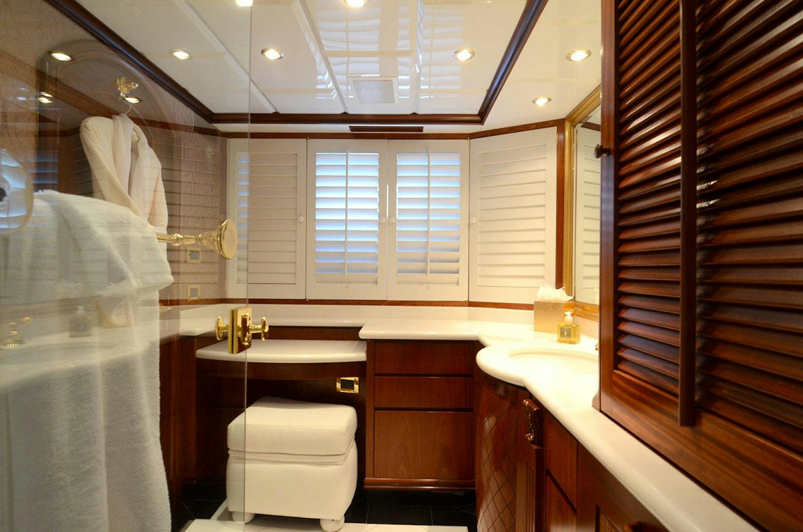 a bathroom with a sink and a toilet aboard OCEAN CLUB Yacht for Sale