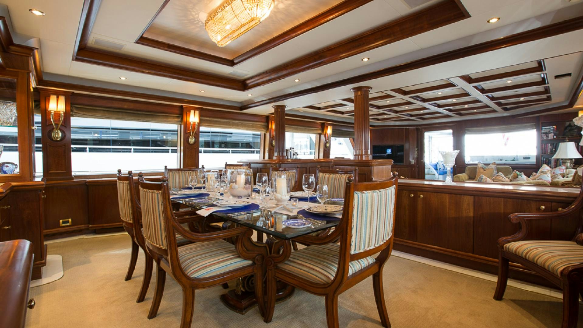 a dining room with a table and chairs aboard OCEAN CLUB Yacht for Sale
