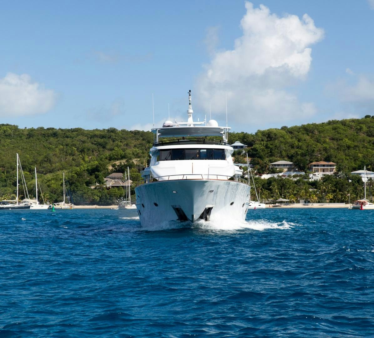 a white boat on the water aboard OCEAN CLUB Yacht for Sale