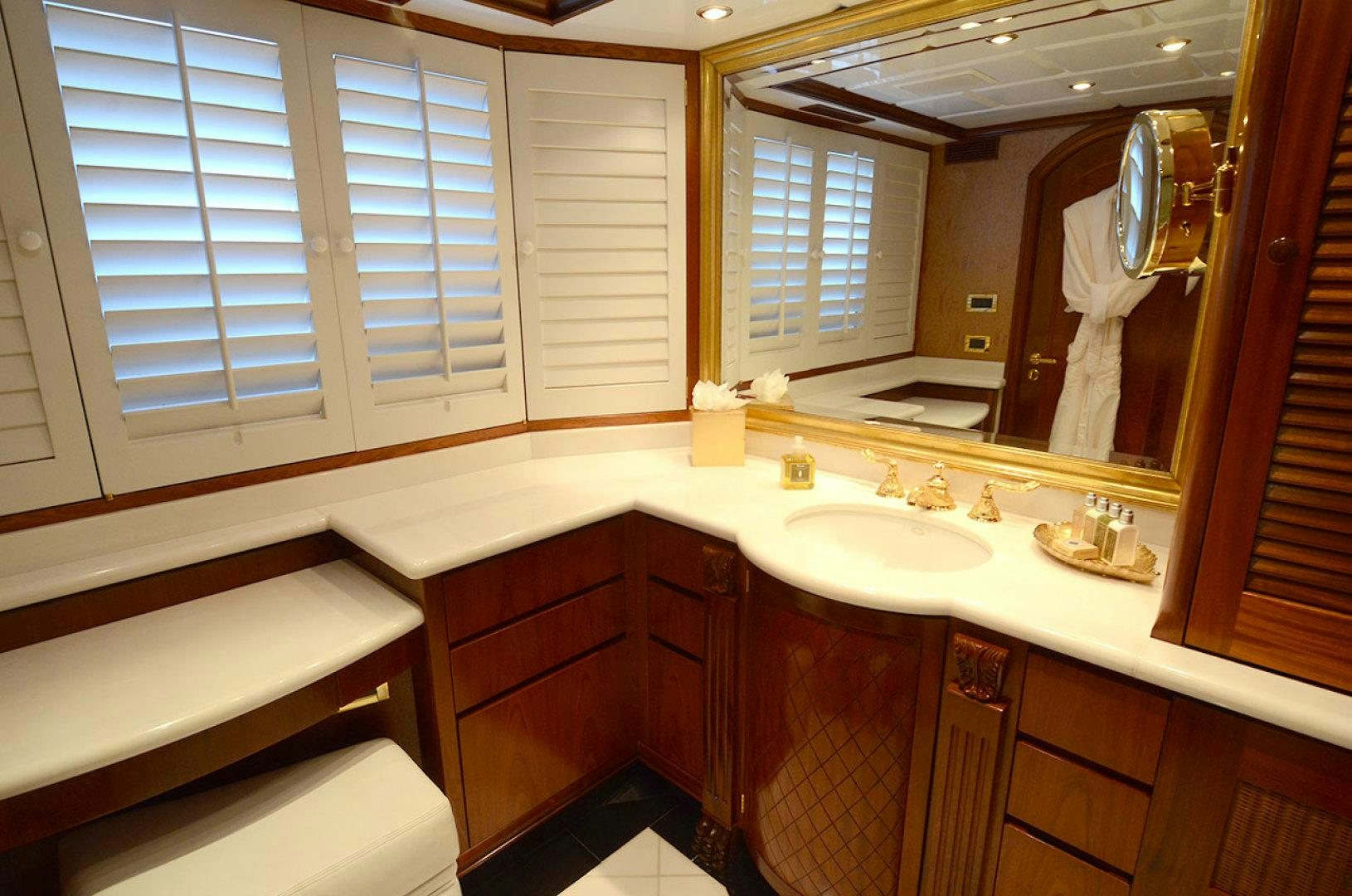 a bathroom with a large mirror aboard OCEAN CLUB Yacht for Sale