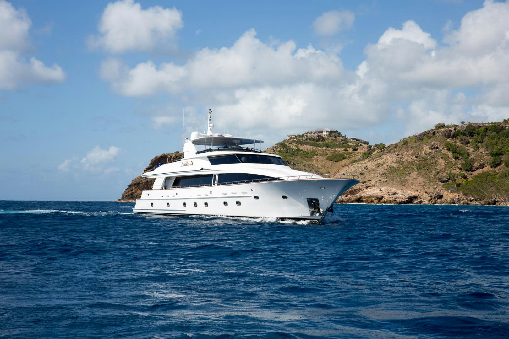 a white yacht in the water aboard OCEAN CLUB Yacht for Sale