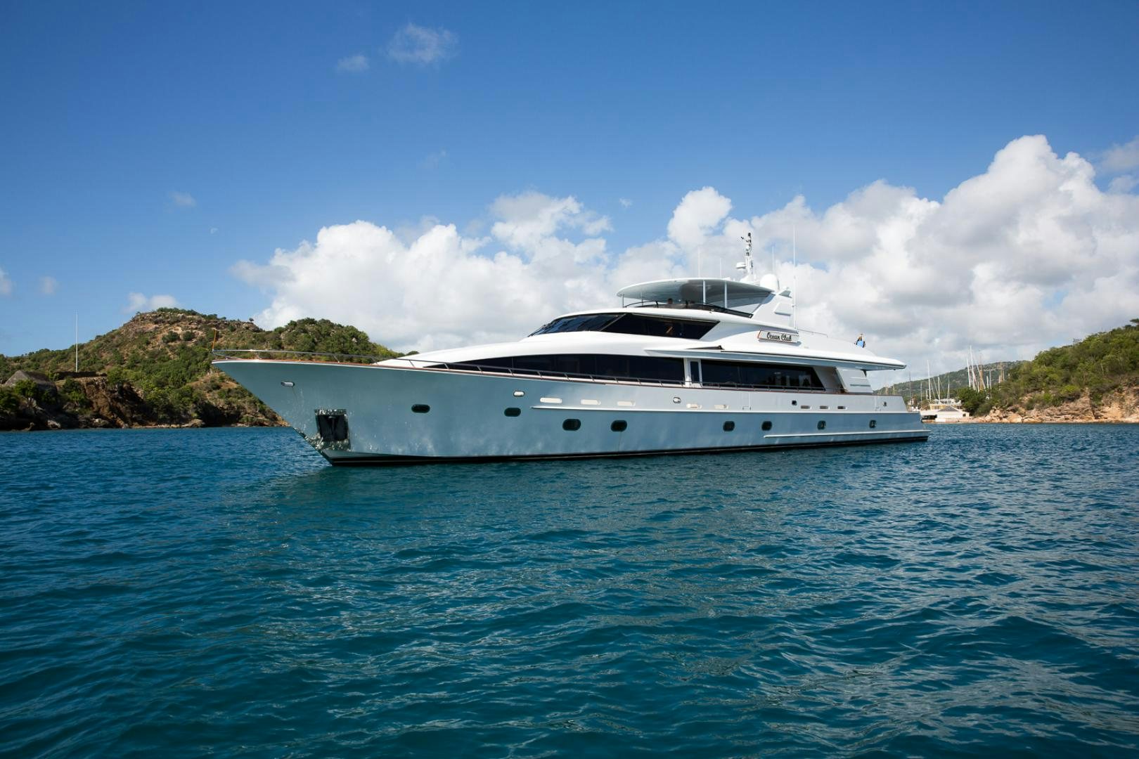 a white yacht in the water aboard OCEAN CLUB Yacht for Sale