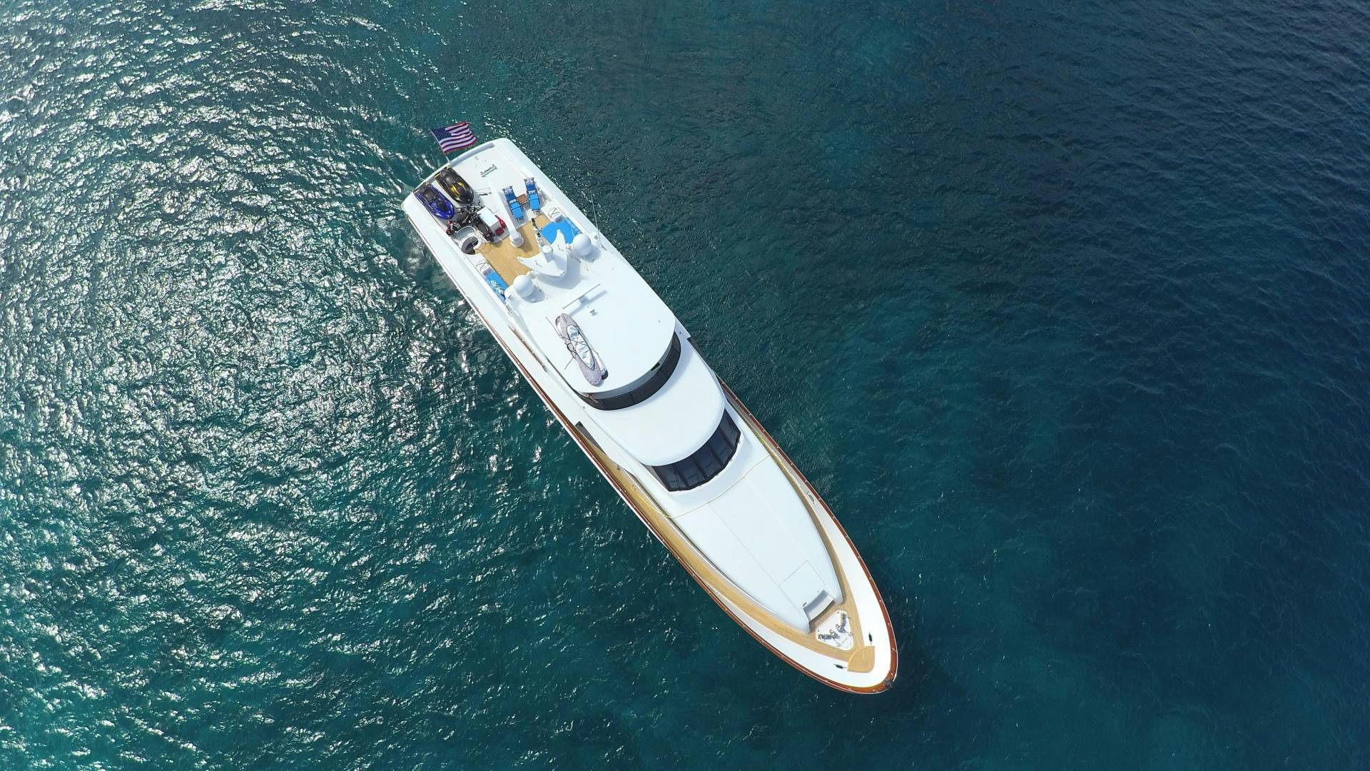 a white and gold boat aboard OCEAN CLUB Yacht for Sale