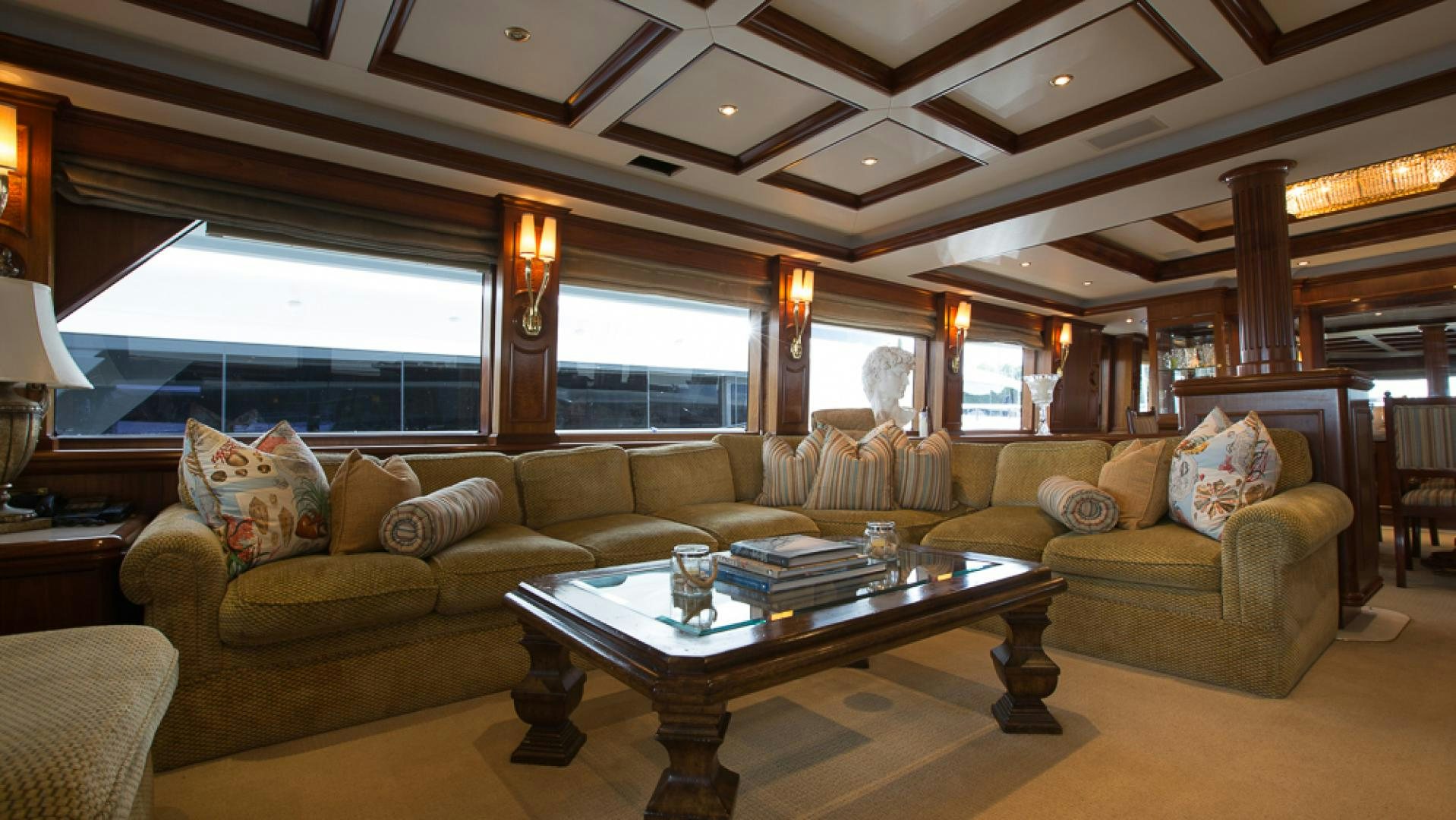 a living room with a large window aboard OCEAN CLUB Yacht for Sale