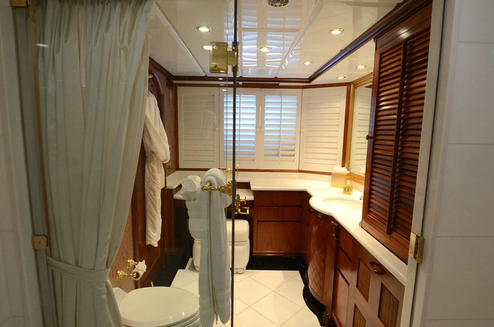 a bathroom with a large shower aboard OCEAN CLUB Yacht for Sale