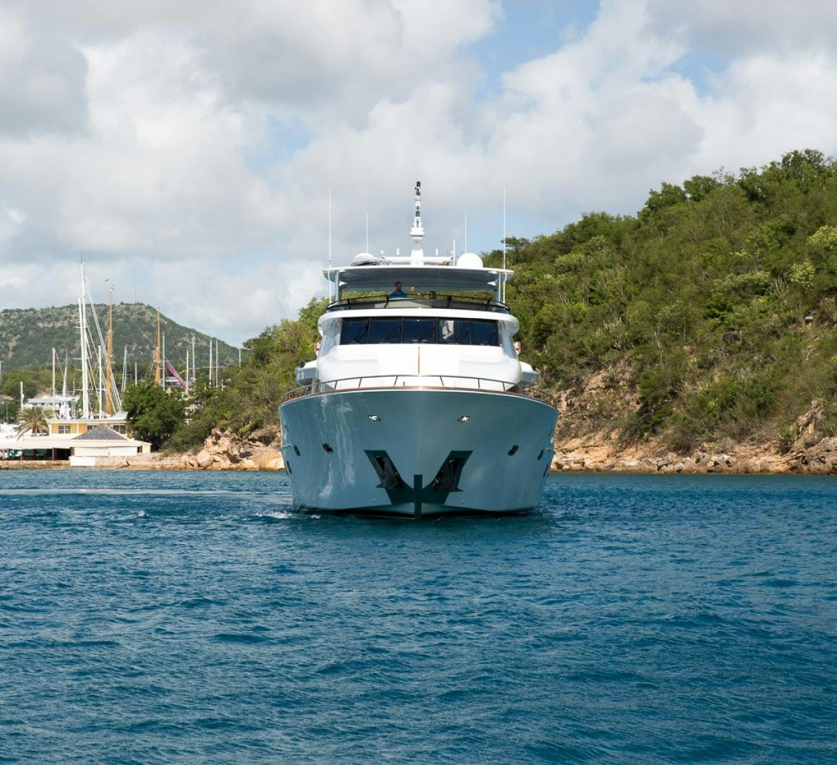 a white boat in the water aboard OCEAN CLUB Yacht for Sale