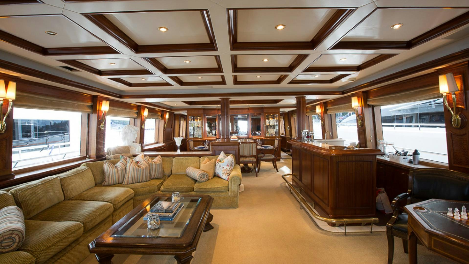 a living room with a large window aboard OCEAN CLUB Yacht for Sale