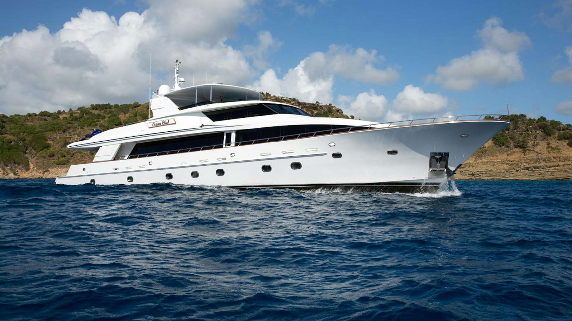 a white yacht in the water aboard OCEAN CLUB Yacht for Sale