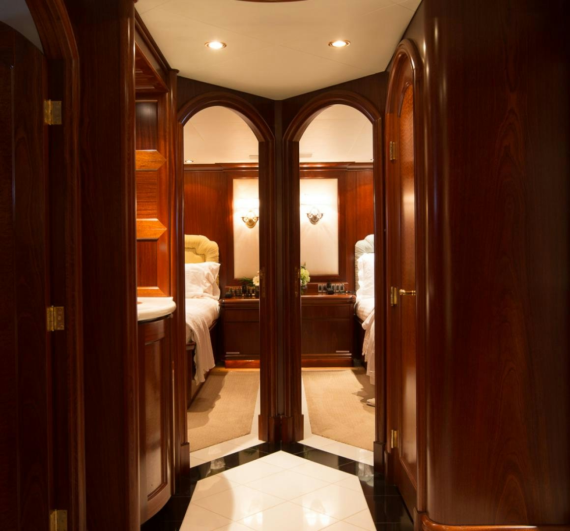 a bathroom with a large mirror aboard OCEAN CLUB Yacht for Sale