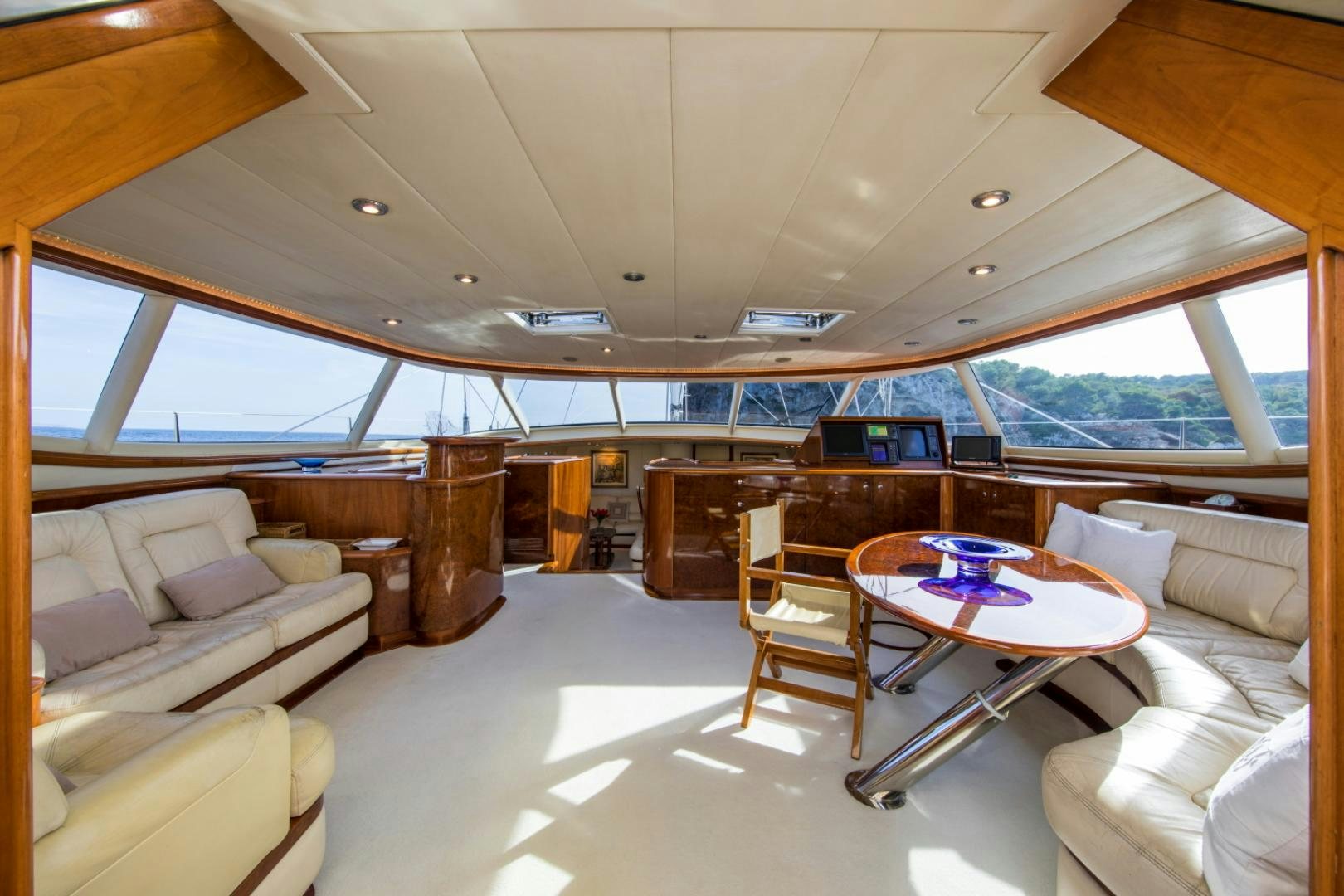a room with a table and chairs aboard SOVEREIGN Yacht for Sale