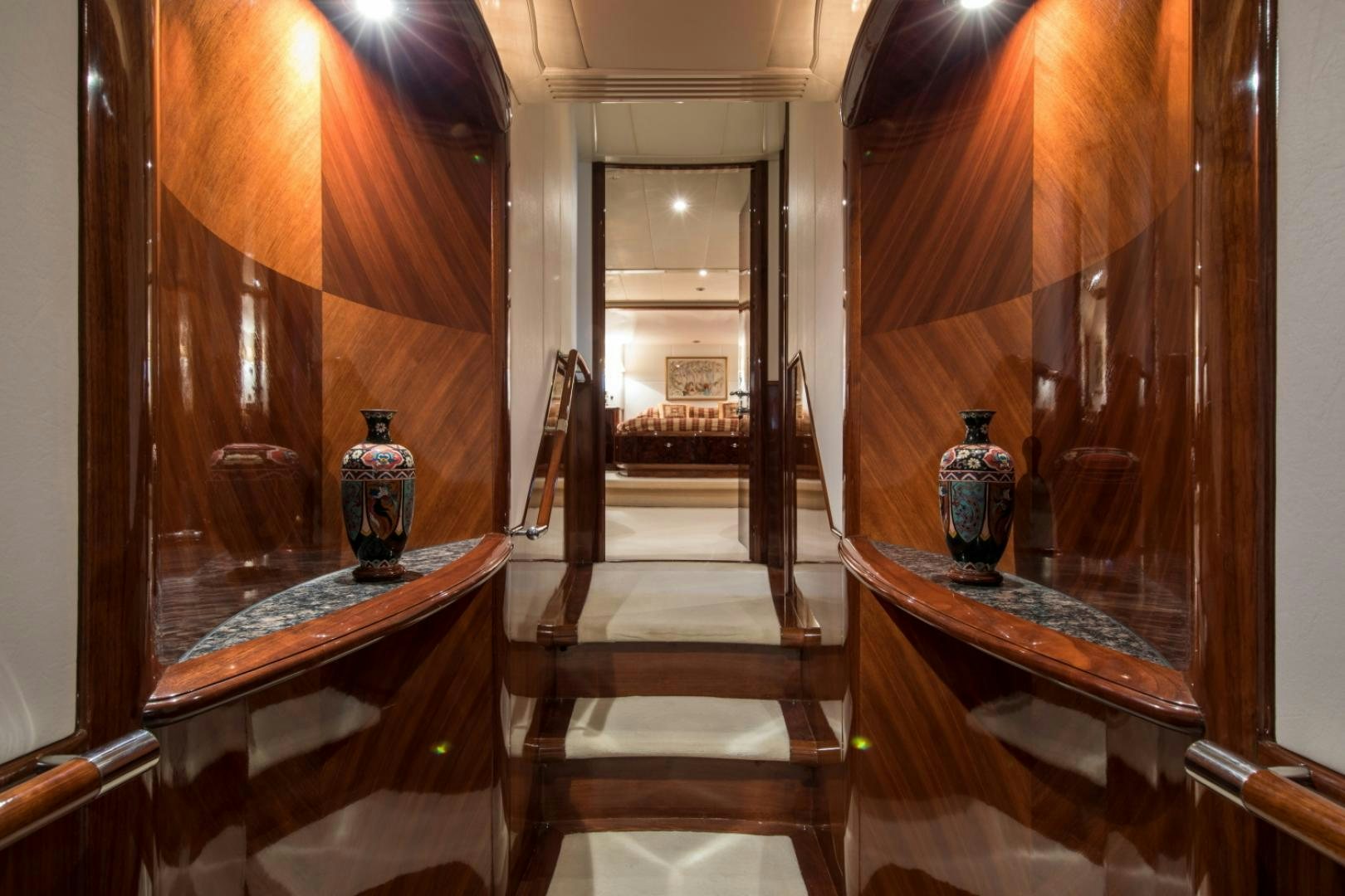a hallway with wood doors aboard SOVEREIGN Yacht for Sale