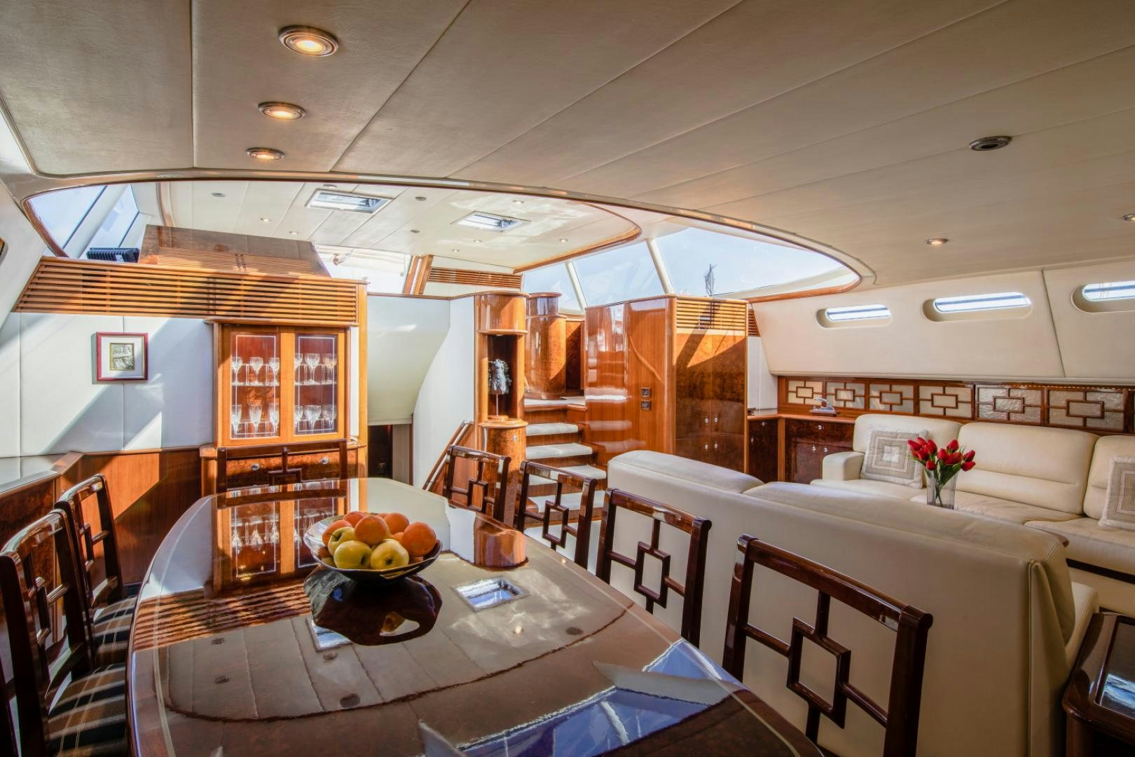a room with tables and chairs aboard SOVEREIGN Yacht for Sale