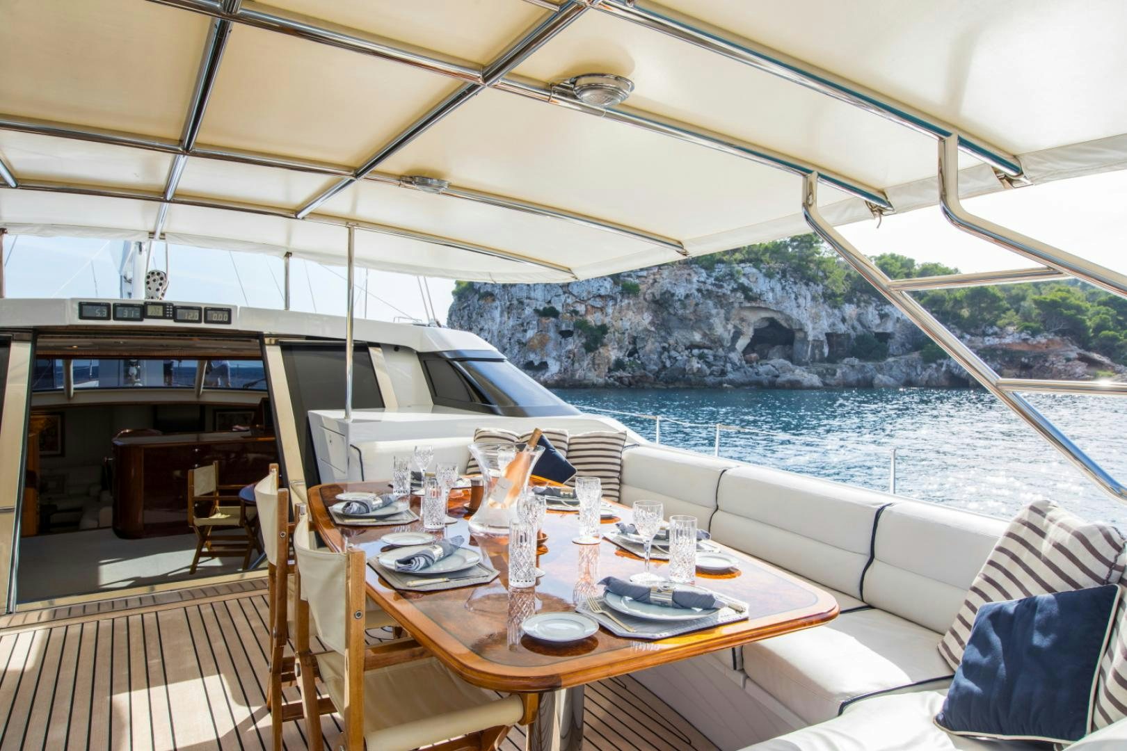 a table set for a meal on a boat aboard SOVEREIGN Yacht for Sale