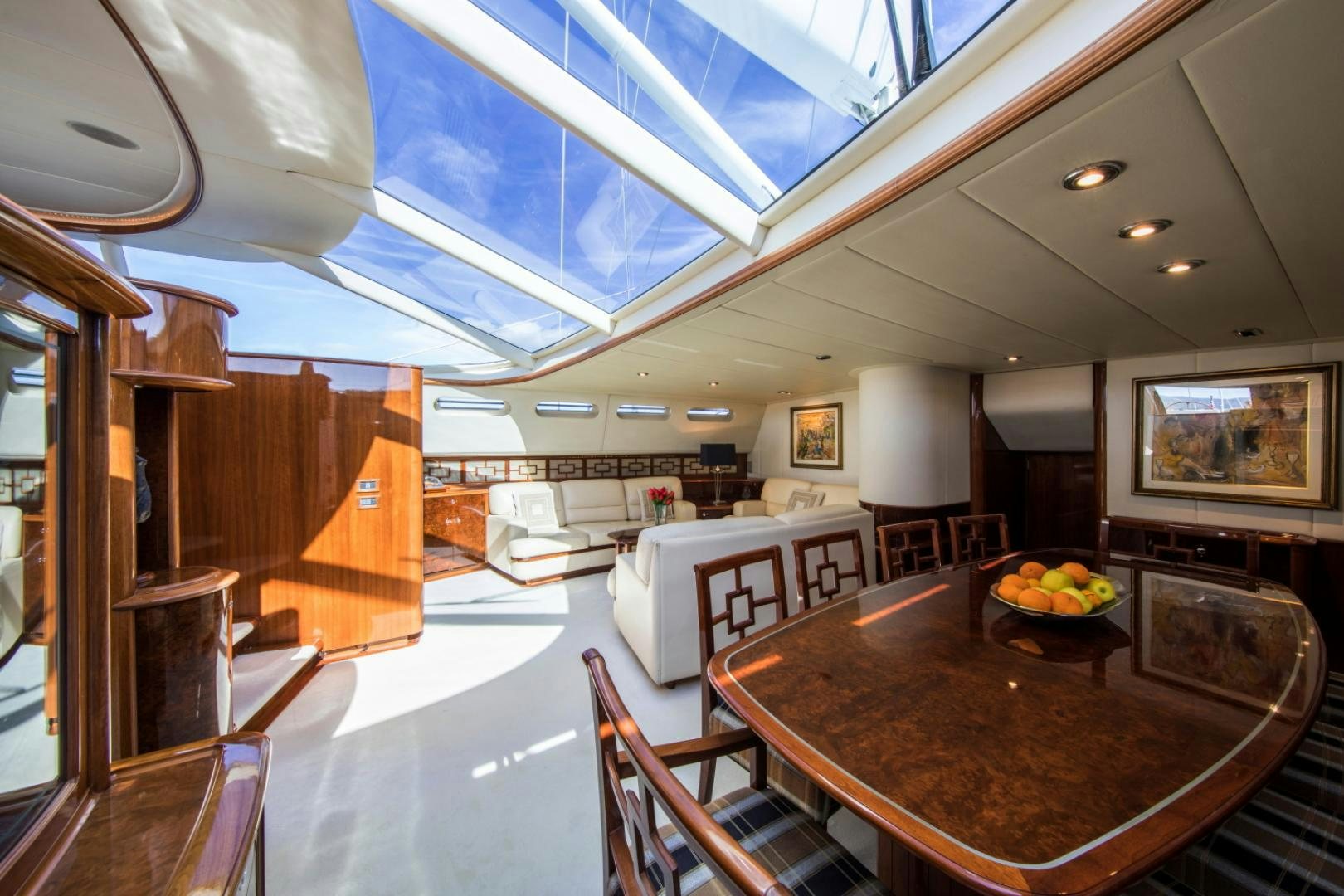 a large kitchen with a table aboard SOVEREIGN Yacht for Sale