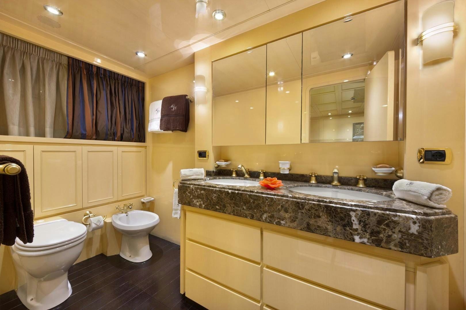 a bathroom with a large countertop aboard DISCO VOLANTE Yacht for Sale