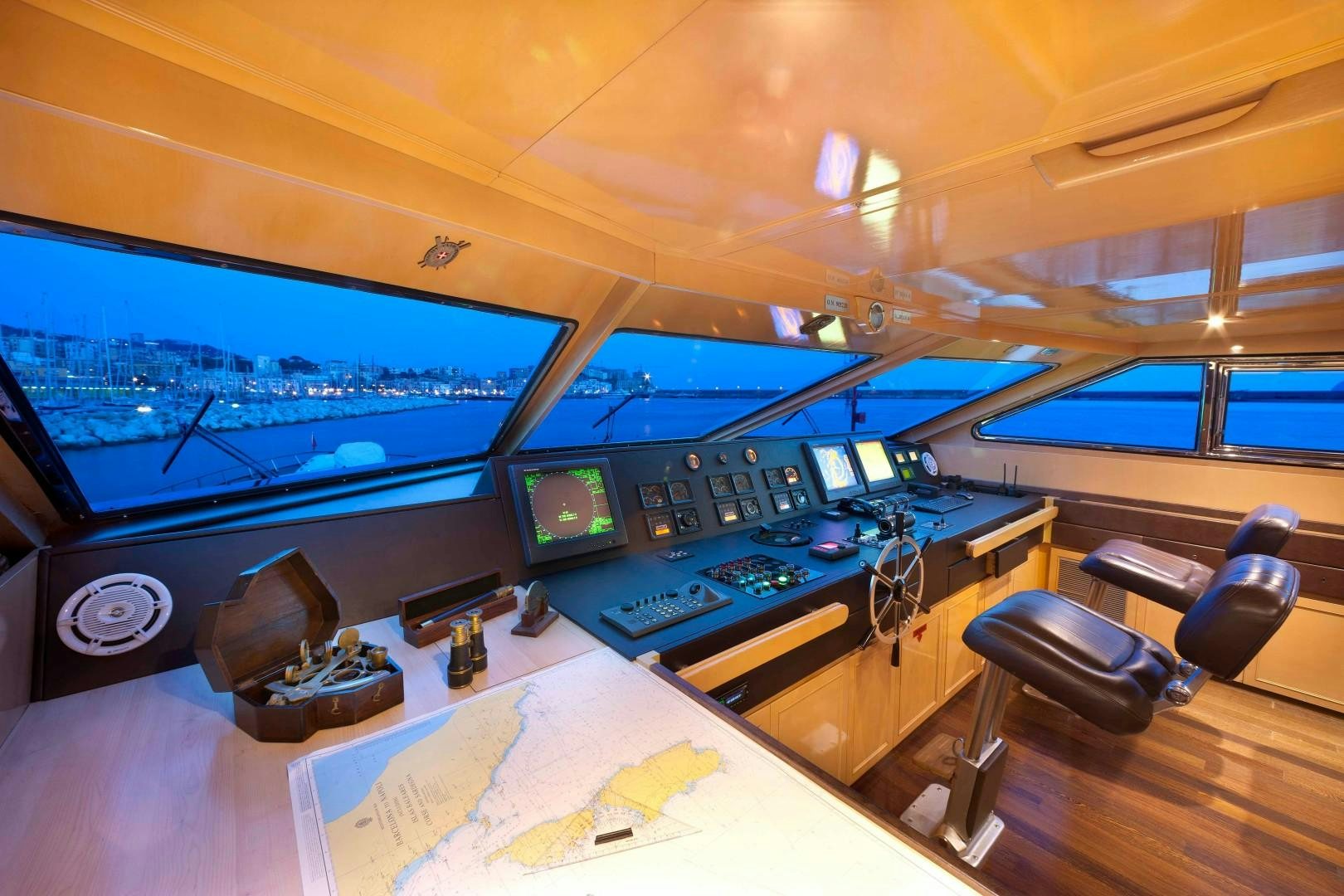 a control room with a large screen aboard DISCO VOLANTE Yacht for Sale
