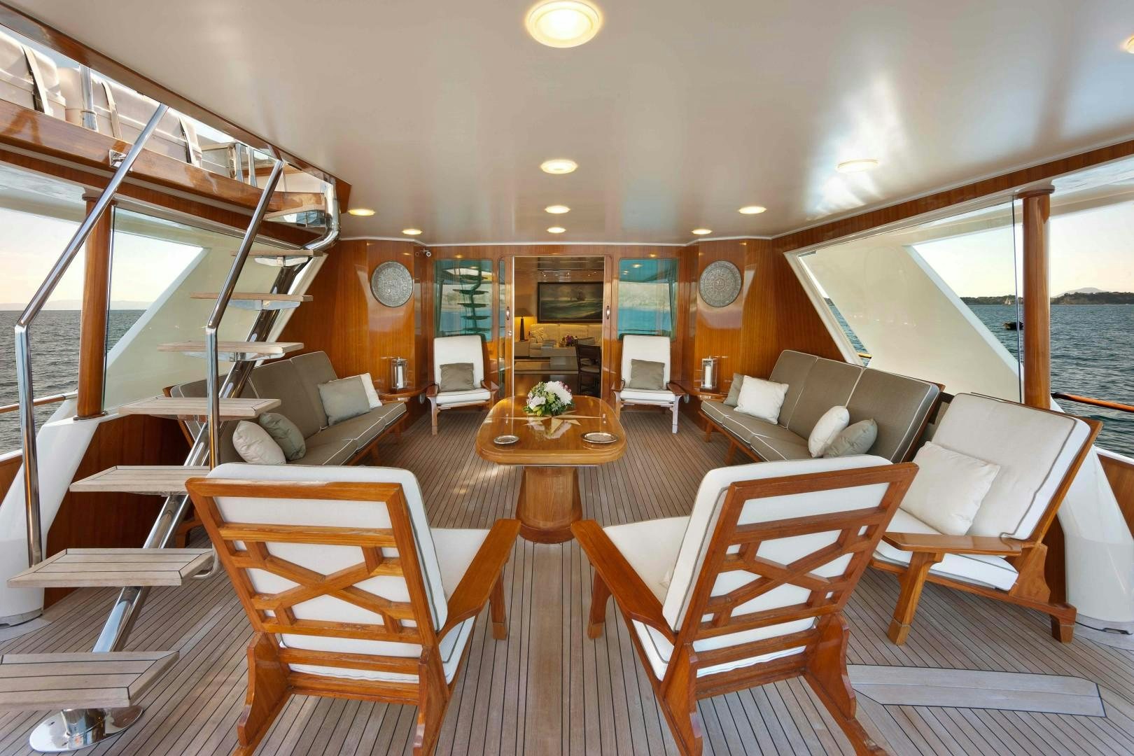a room with a couch and a table and chairs aboard DISCO VOLANTE Yacht for Sale