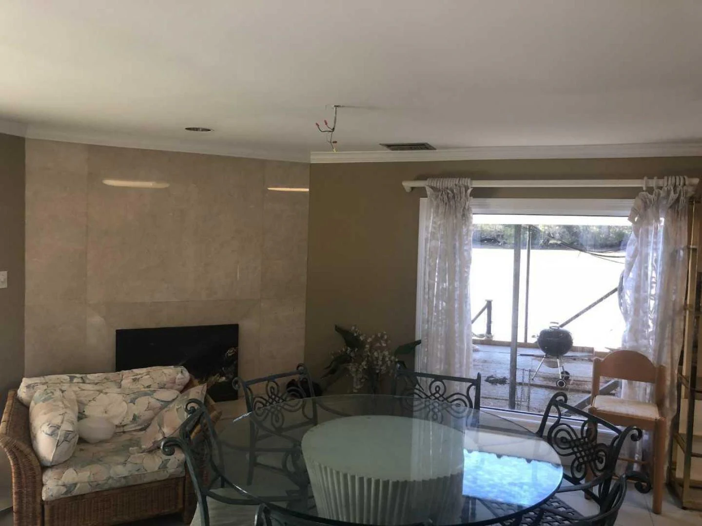 a living room with a fireplace aboard LAKEHOUSE Yacht for Sale