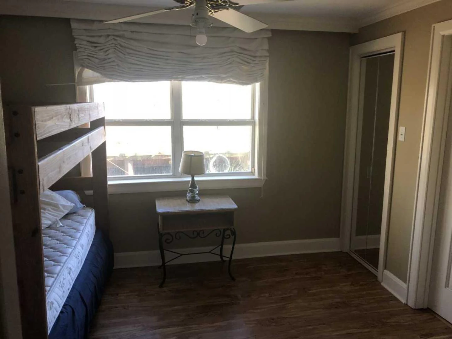 a bedroom with a bed and a table aboard LAKEHOUSE Yacht for Sale
