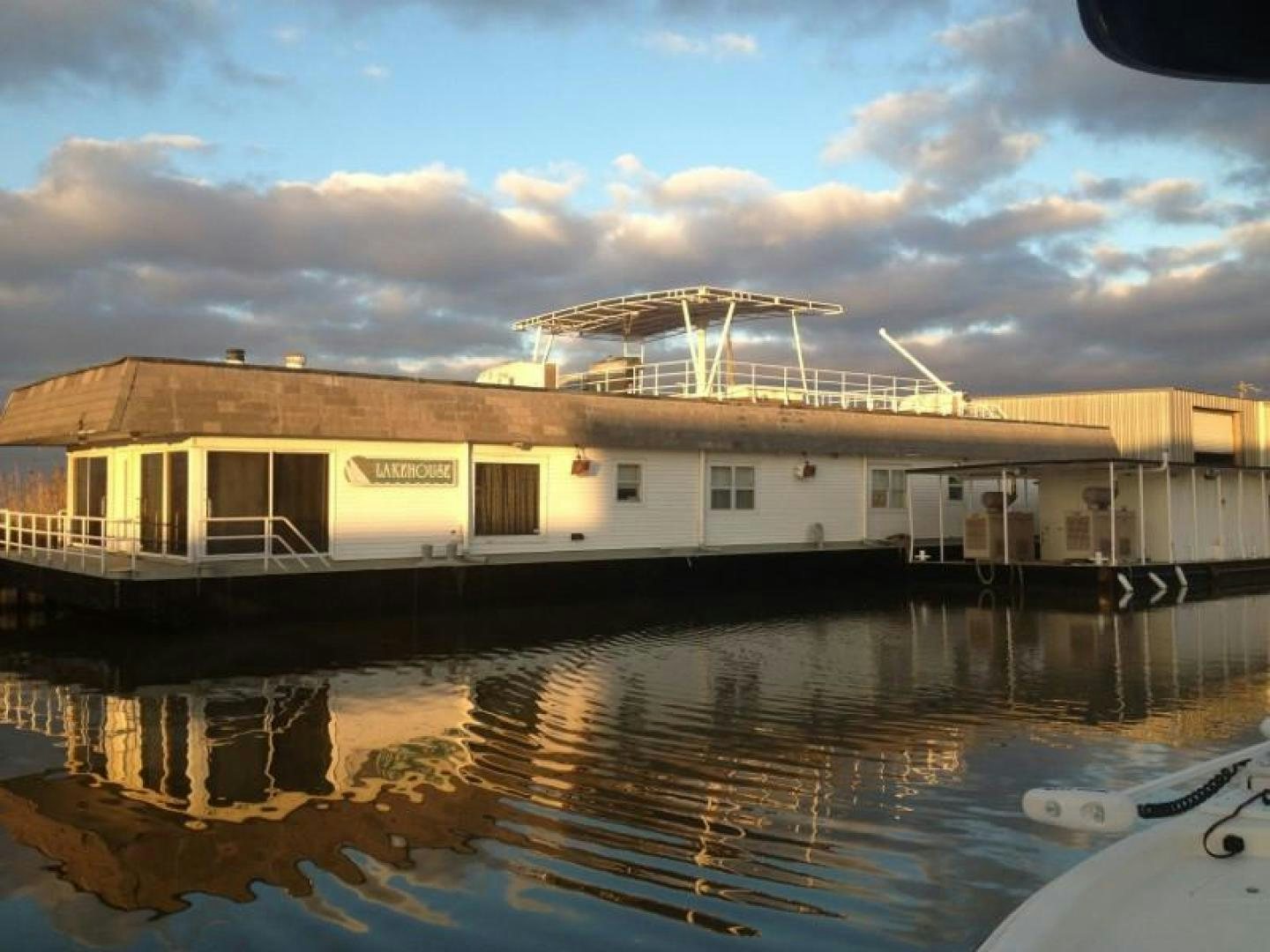 a building with a swimming pool aboard LAKEHOUSE Yacht for Sale