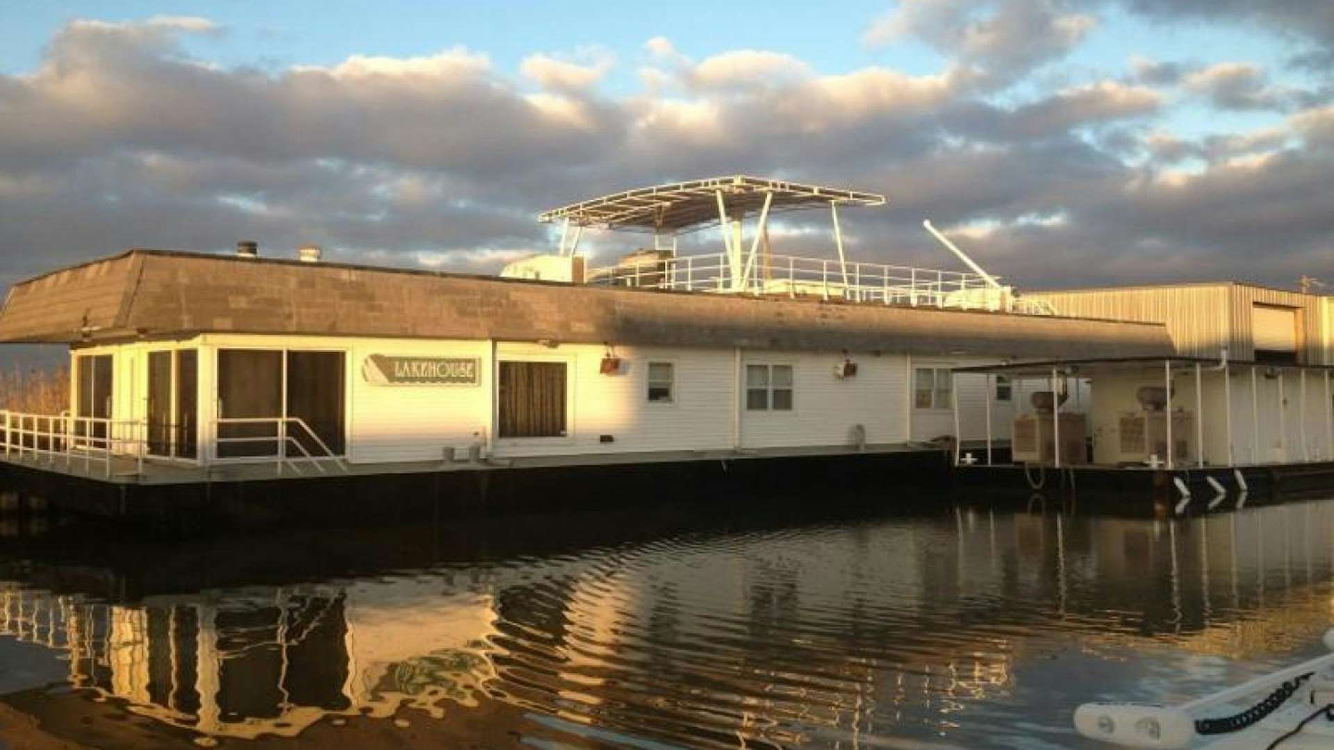 a building with a swimming pool aboard LAKEHOUSE Yacht for Sale