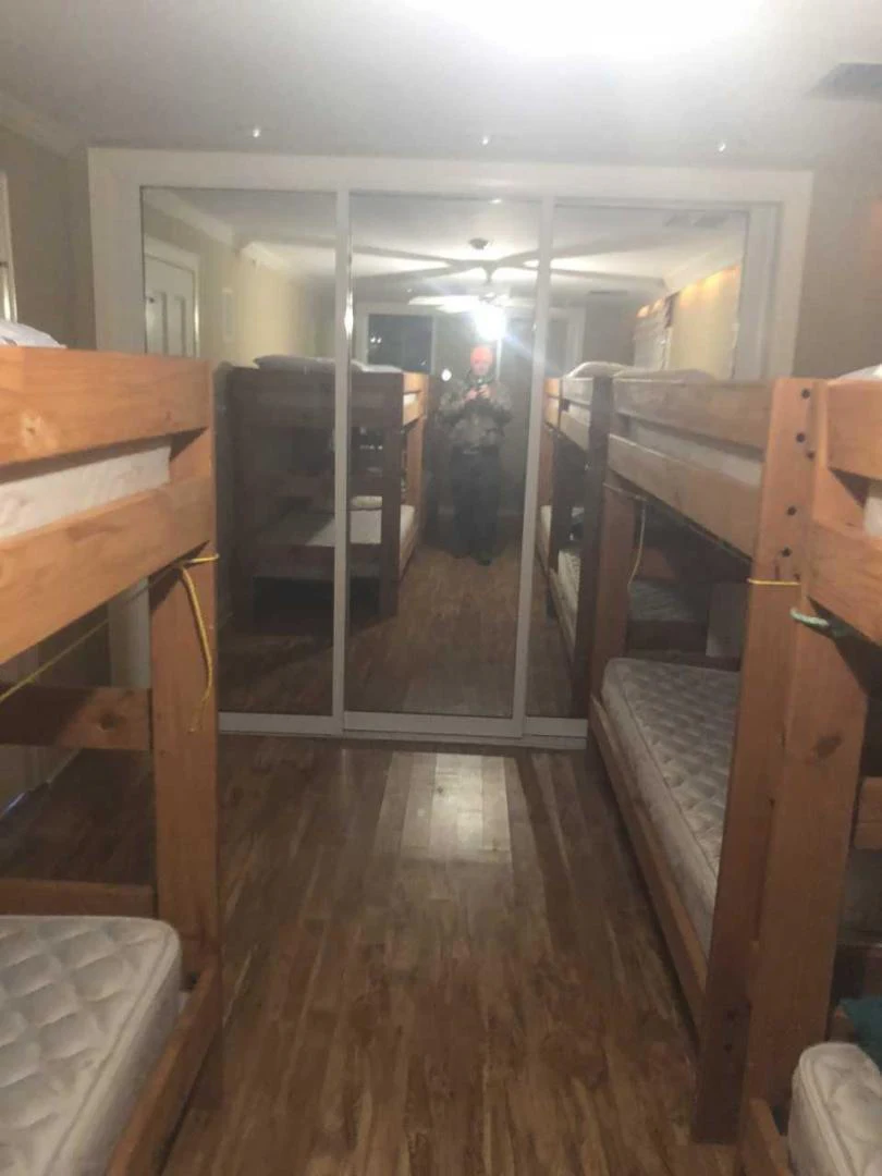 a room with wooden floors and wood cabinets aboard LAKEHOUSE Yacht for Sale
