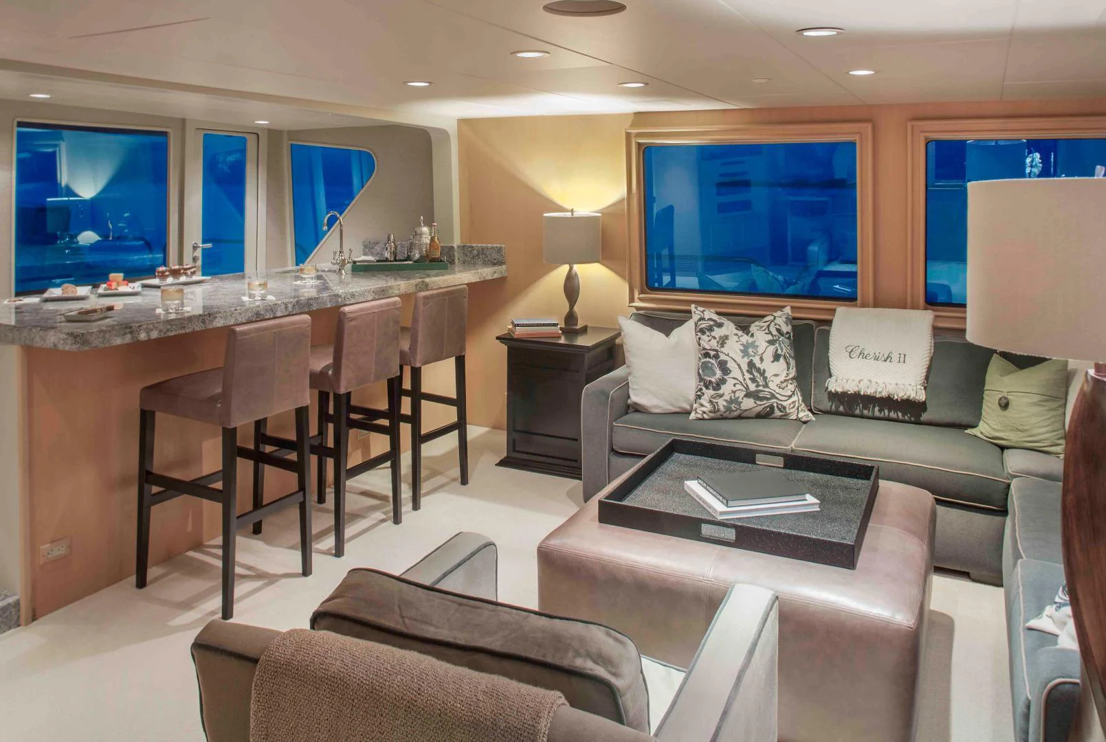 a living room with a couch and a table aboard CHERISH Yacht for Sale