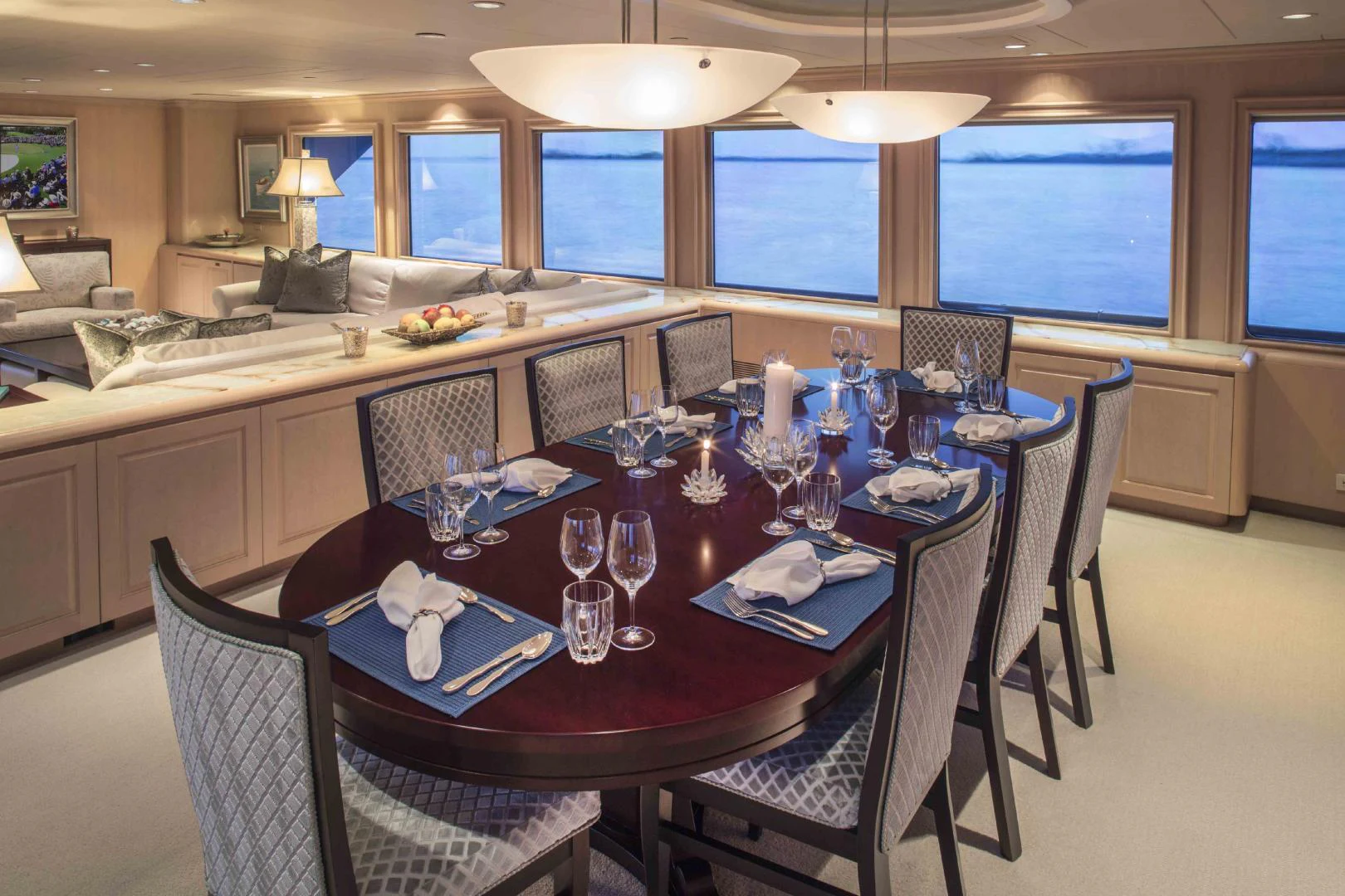 a dining room with a table set for a dinner aboard CHERISH Yacht for Sale