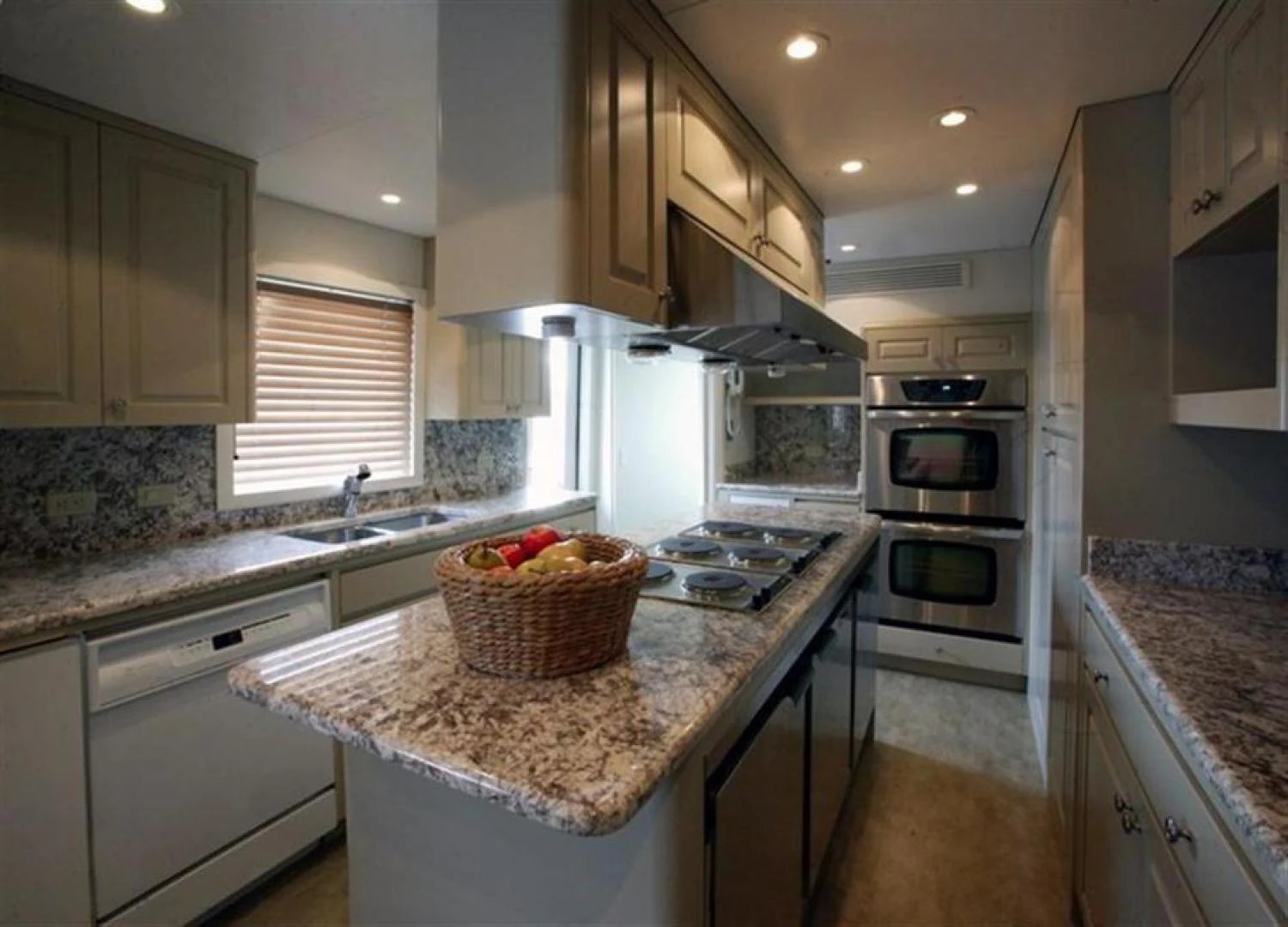 a kitchen with a basket on the counter aboard CHERISH Yacht for Sale