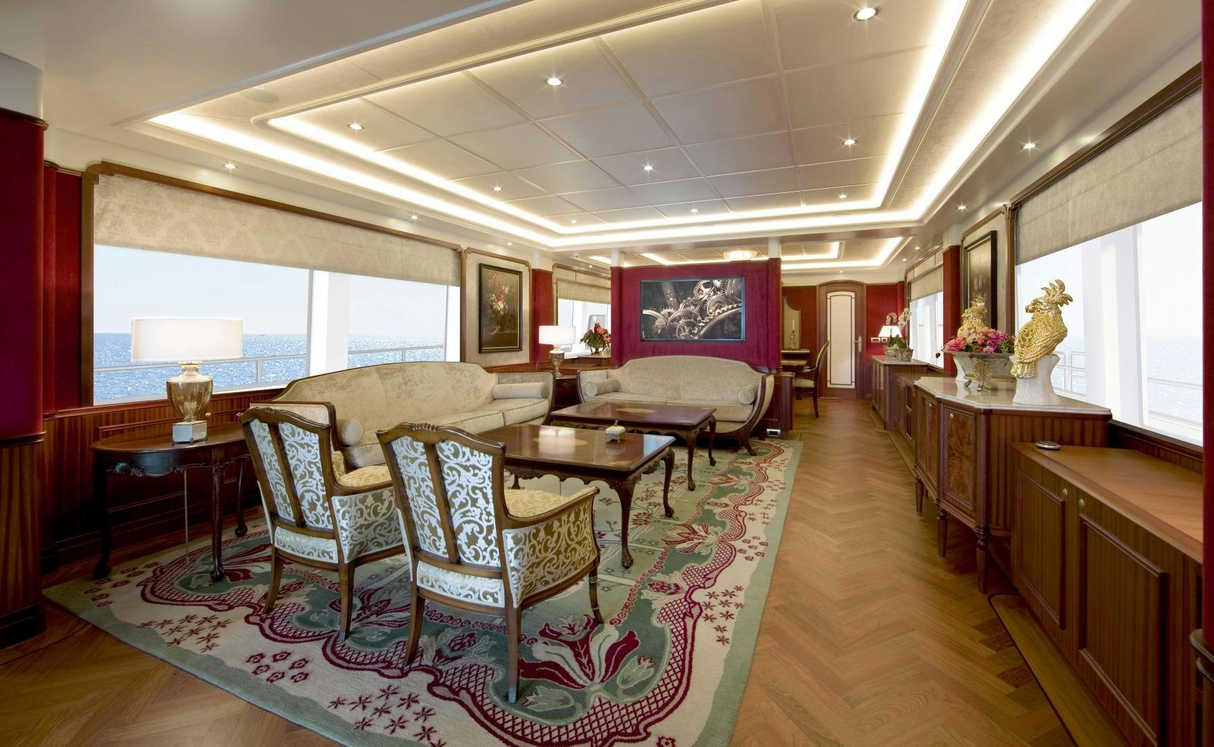 a large living room with a colorful rug aboard NO NAME Yacht for Sale