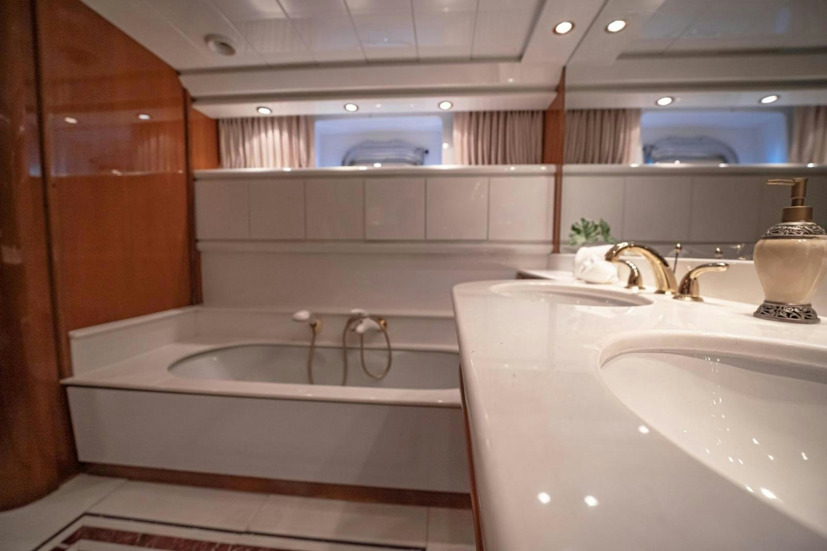 a bathroom with a bathtub and sink aboard SHALIMAR Yacht for Sale