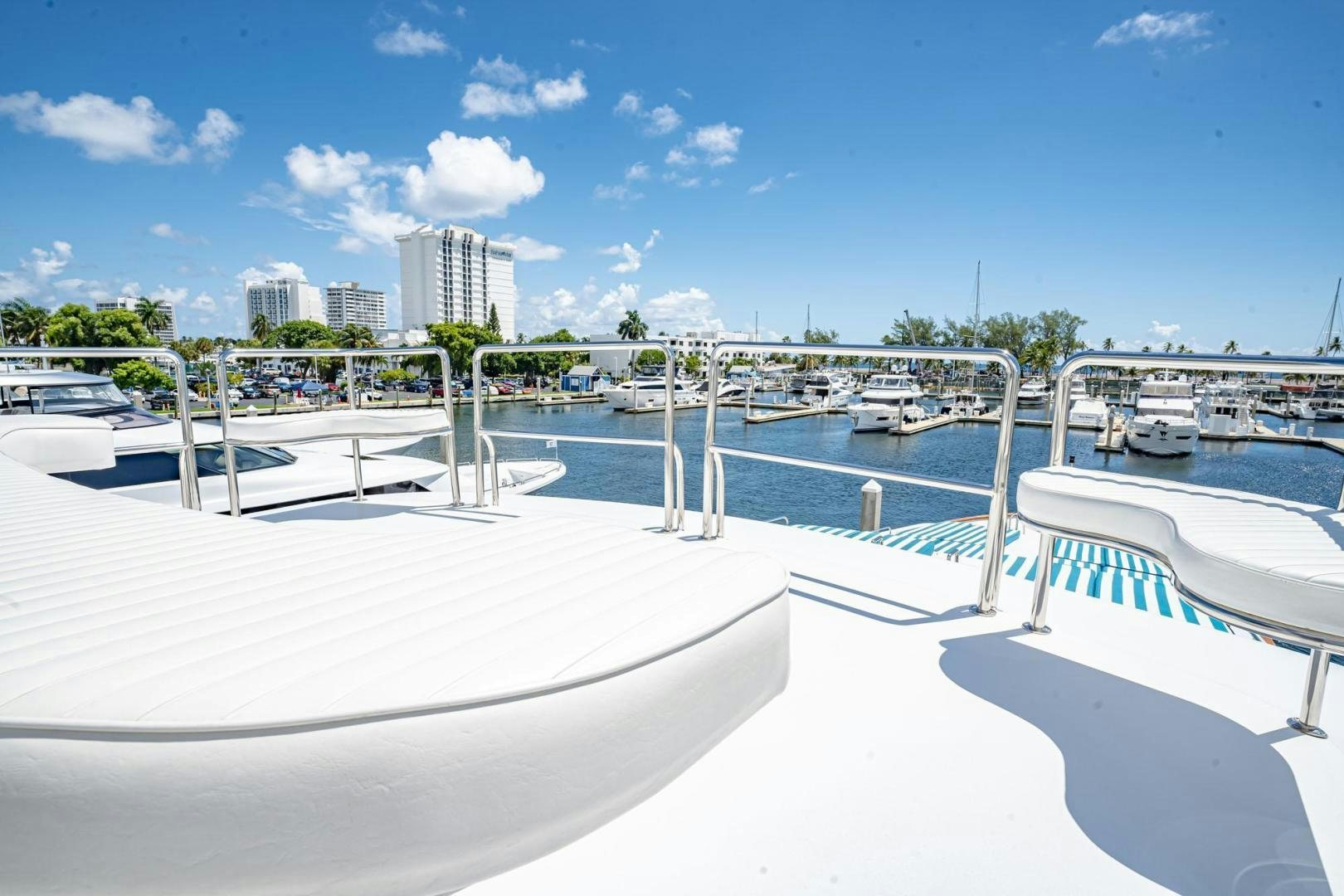 a white pool with a city in the background aboard SHALIMAR Yacht for Sale