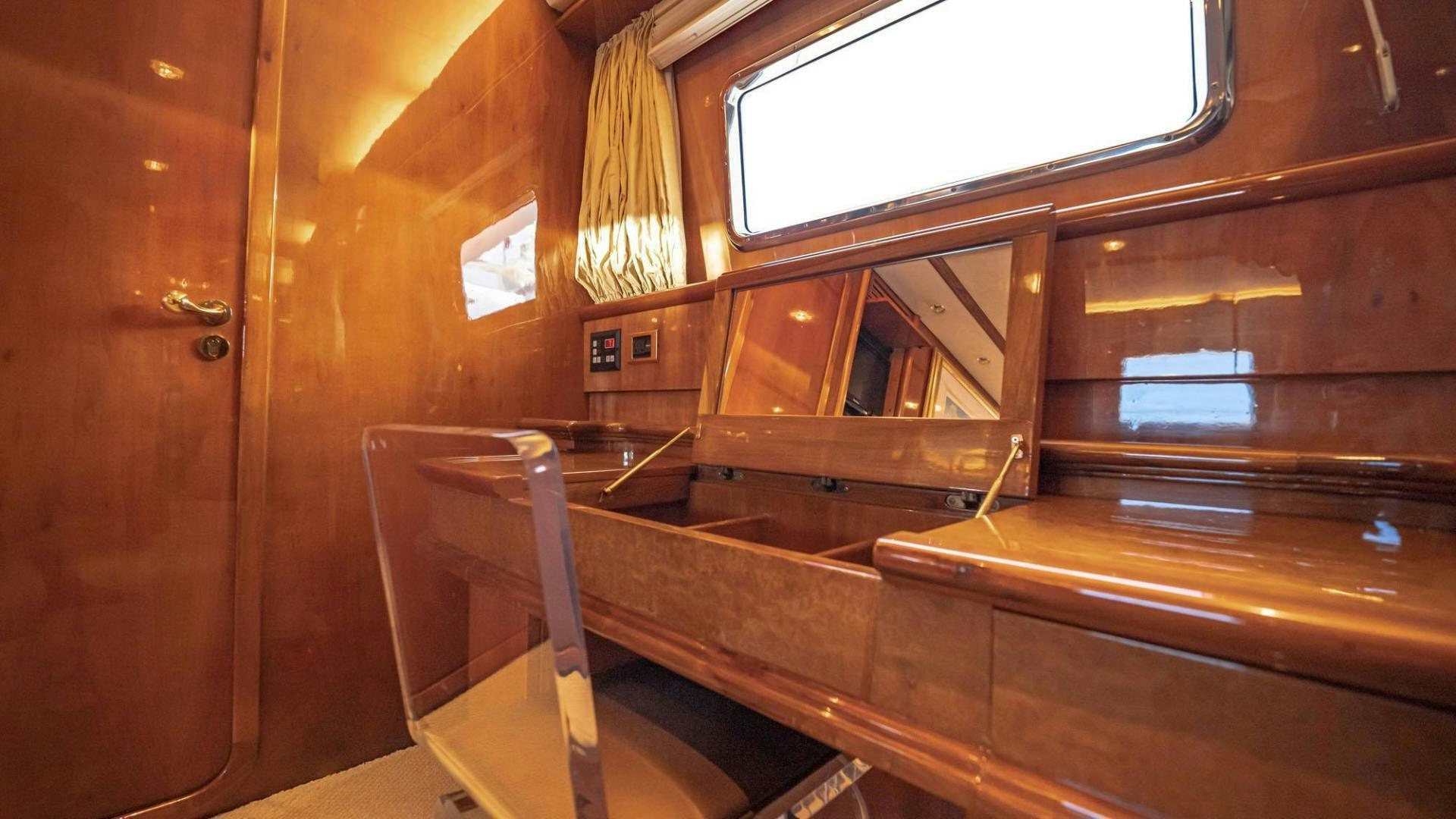 a wooden bathroom with a large mirror aboard SHALIMAR Yacht for Sale