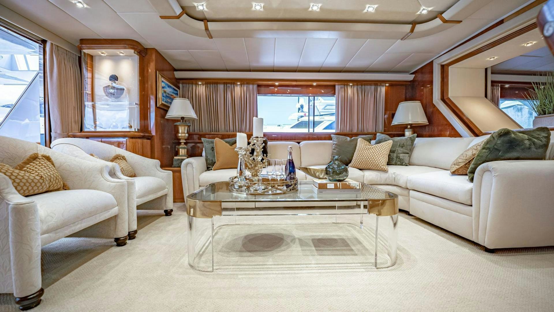 a living room with a large table and couches aboard SHALIMAR Yacht for Sale