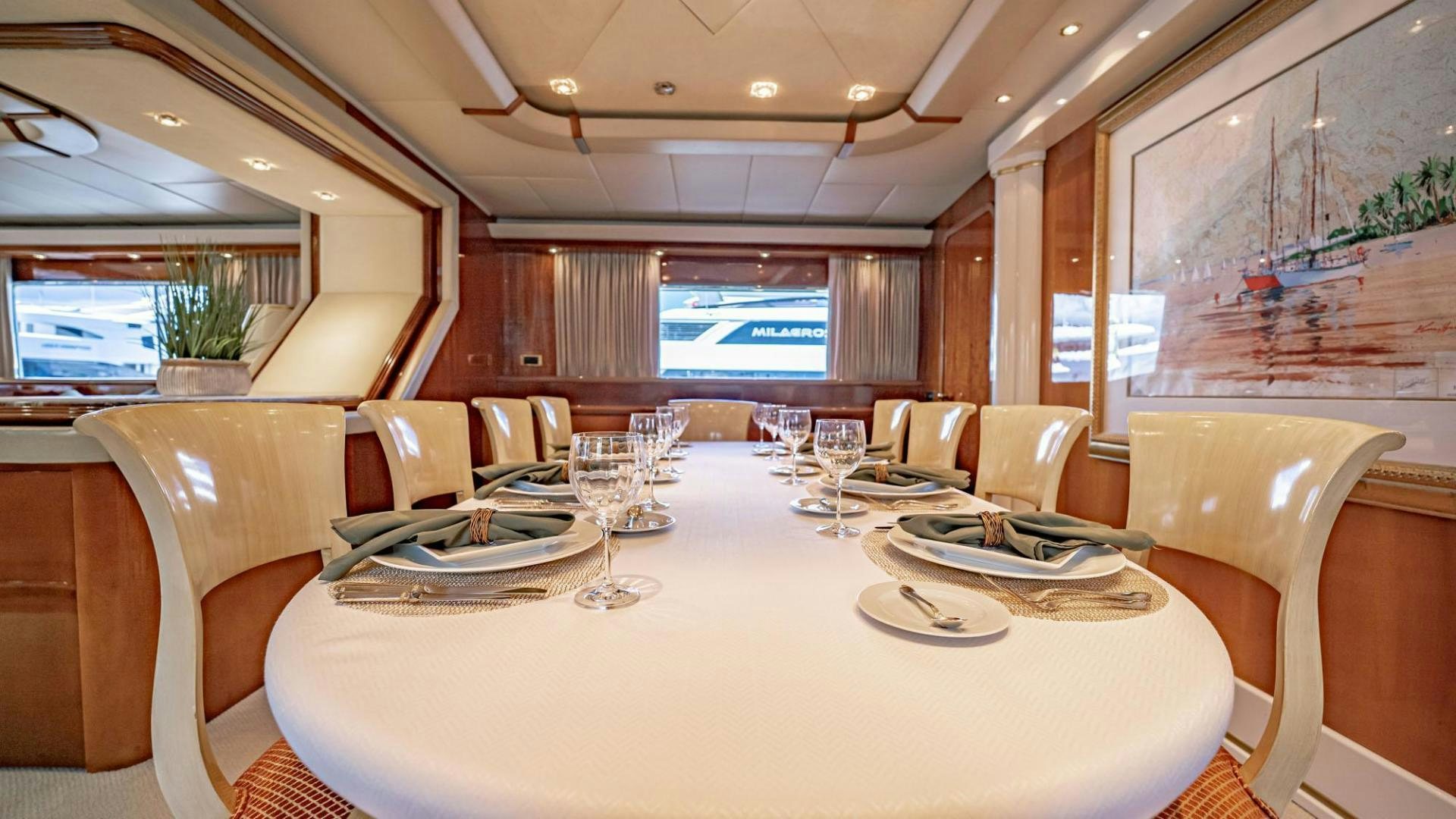 a large dining room with a large table and chairs aboard SHALIMAR Yacht for Sale