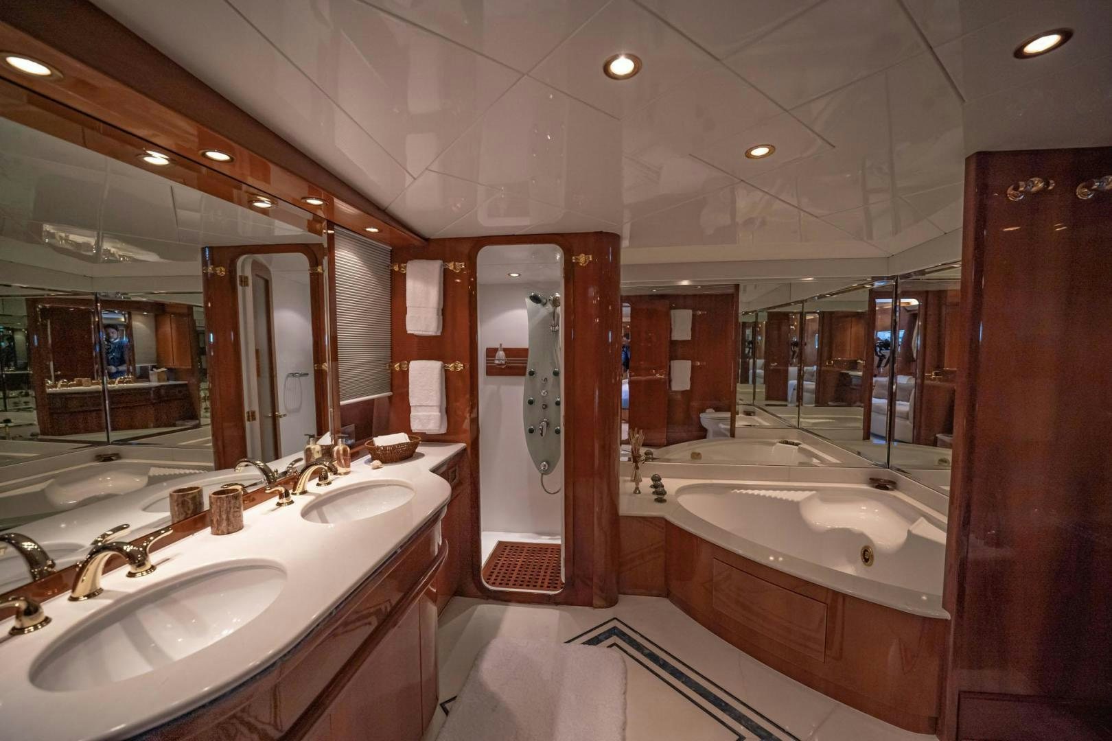 a bathroom with a large mirror aboard SHALIMAR Yacht for Sale