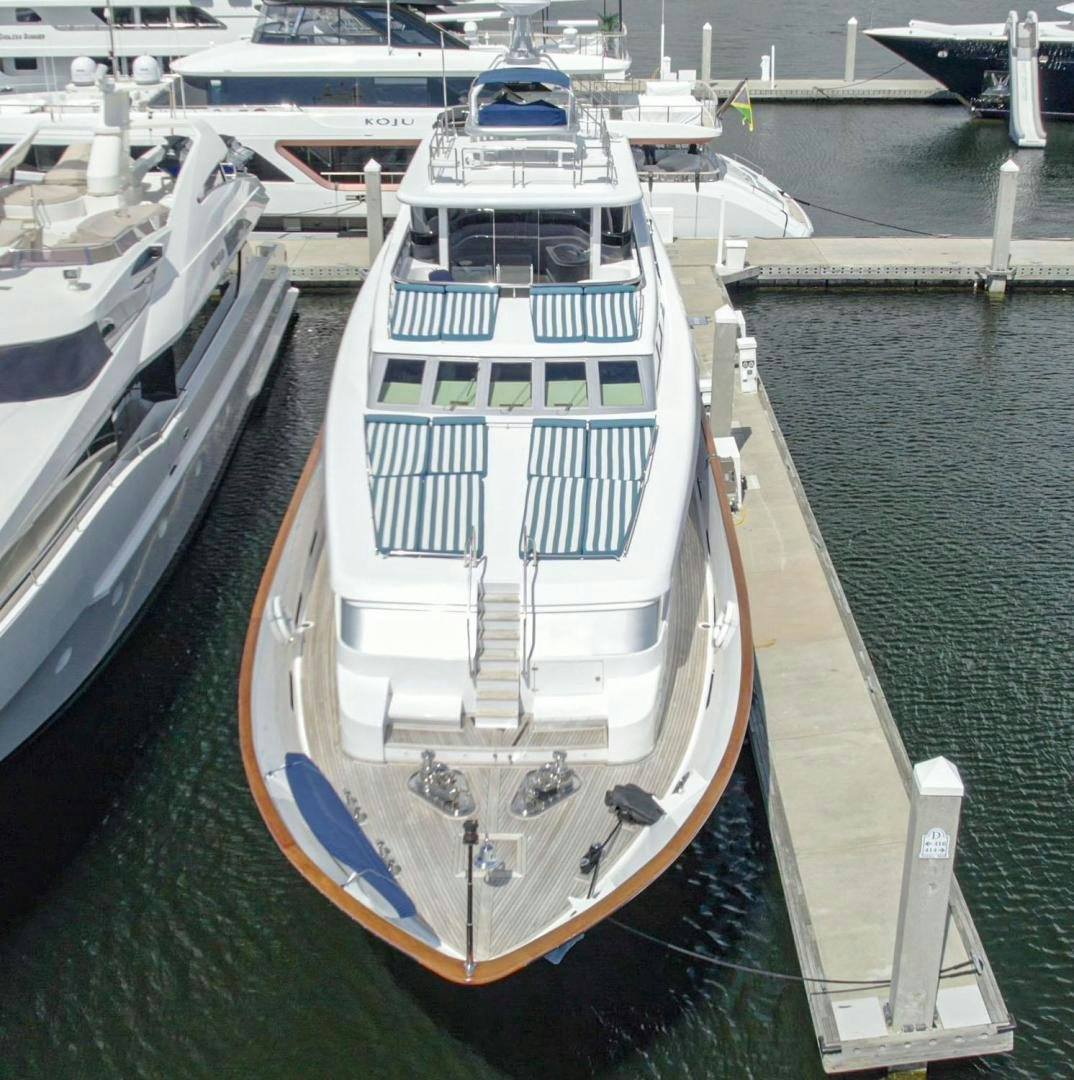 a large white boat in a harbor aboard SHALIMAR Yacht for Sale