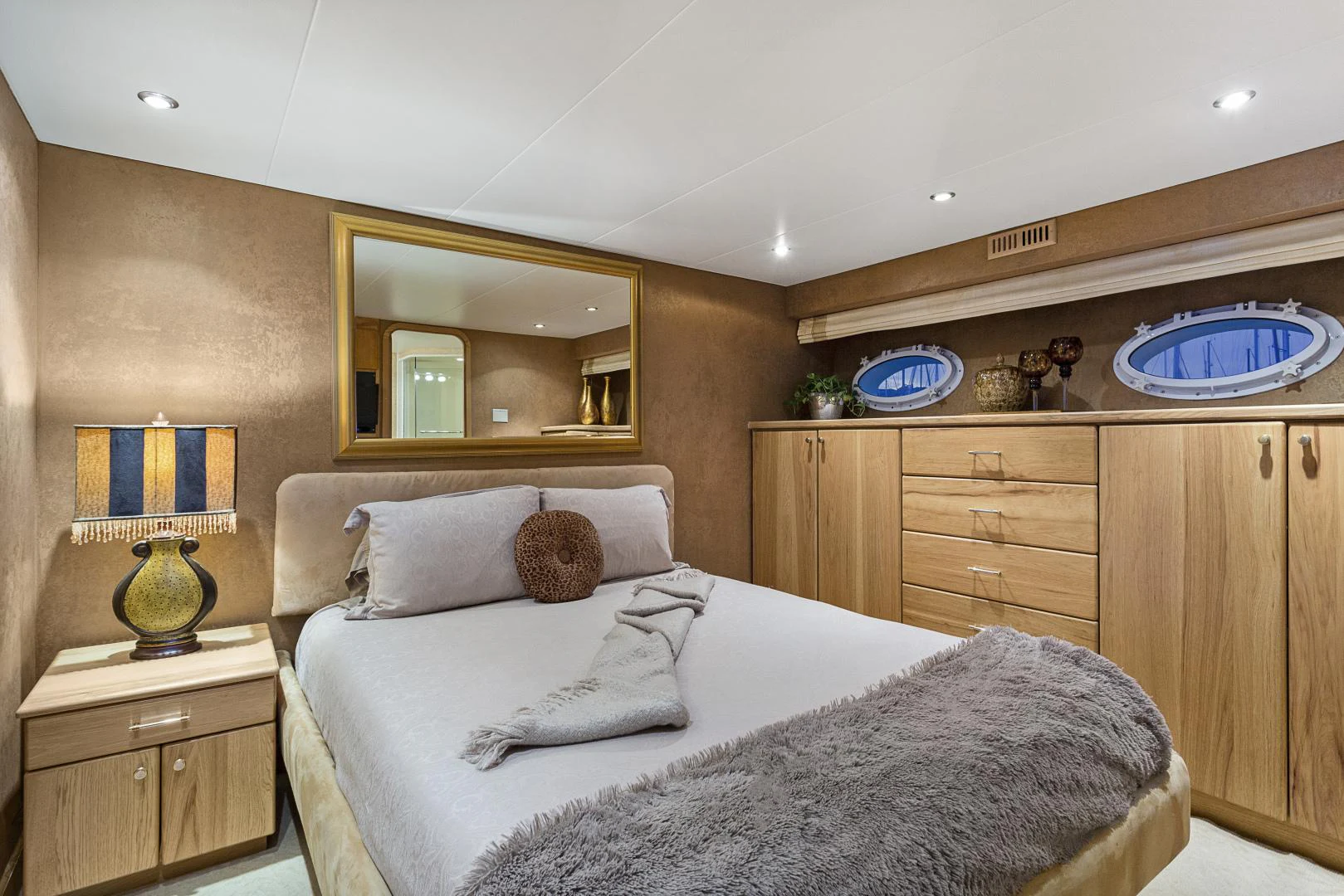 a bedroom with a bed and a mirror aboard ISABELLA Yacht for Sale