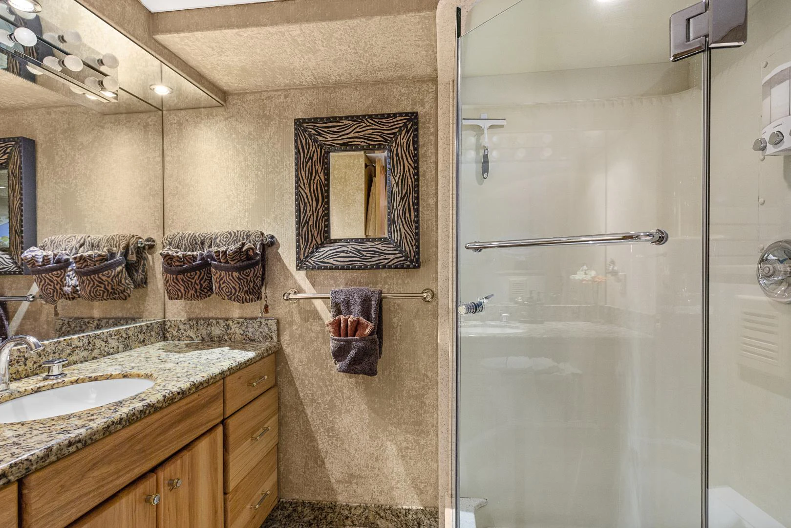 a bathroom with a glass shower aboard ISABELLA Yacht for Sale