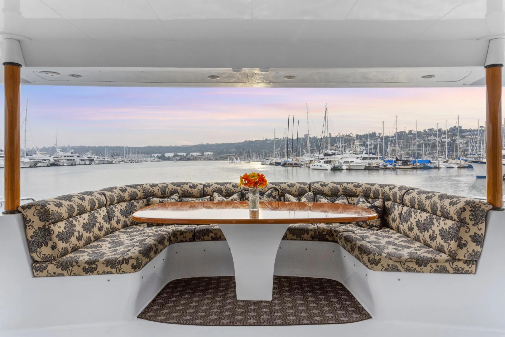 a table on a bench overlooking a city aboard ISABELLA Yacht for Sale