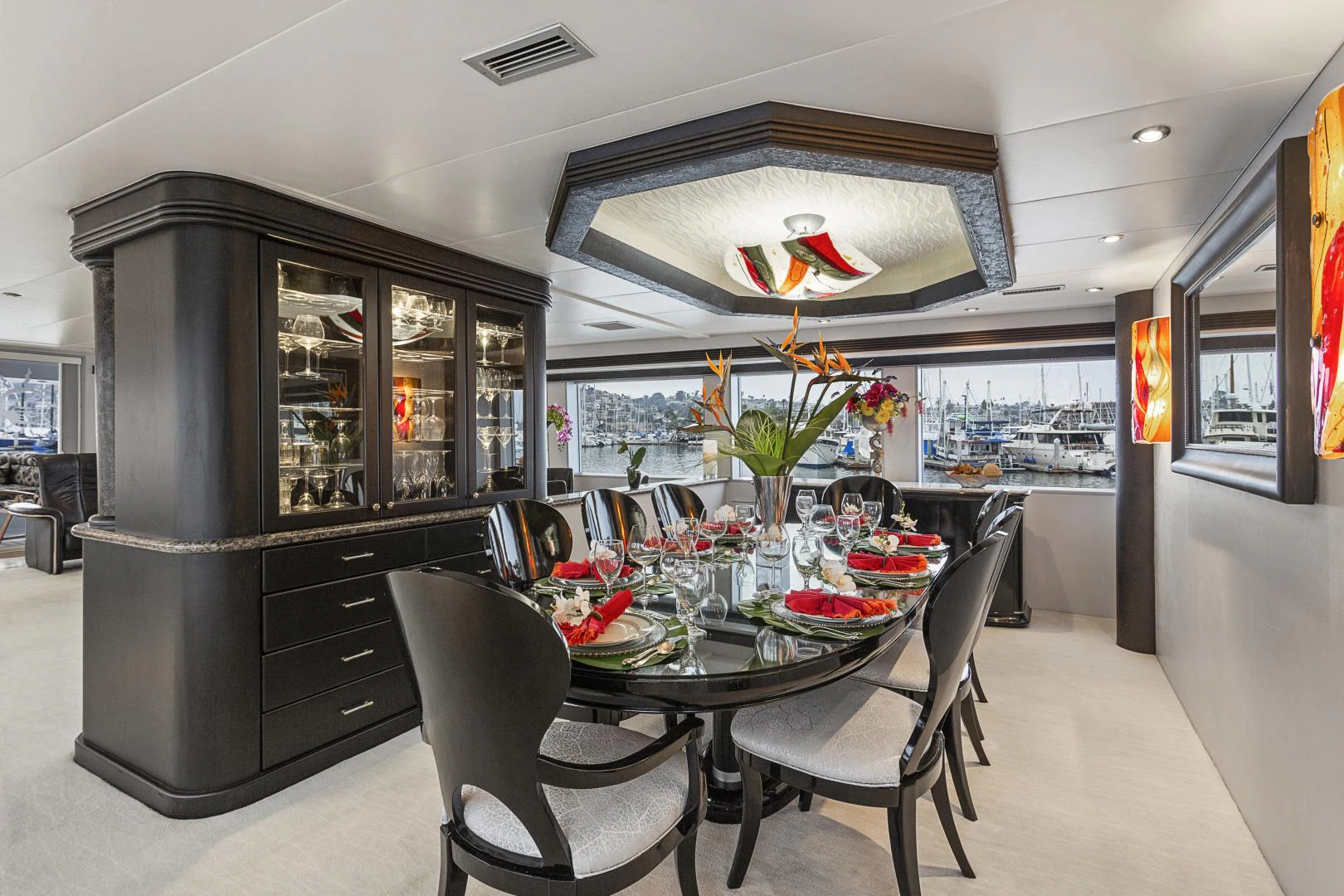 a dining room with a large black refrigerator aboard ISABELLA Yacht for Sale