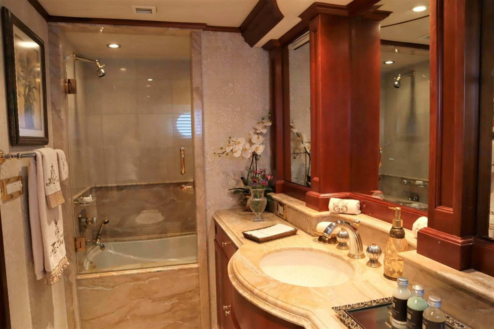 a bathroom with a shower and sink aboard ELIZABETH Yacht for Sale