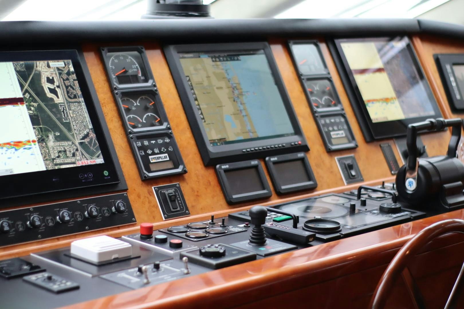 a desk with a laptop and other electronics on it aboard ELIZABETH Yacht for Sale