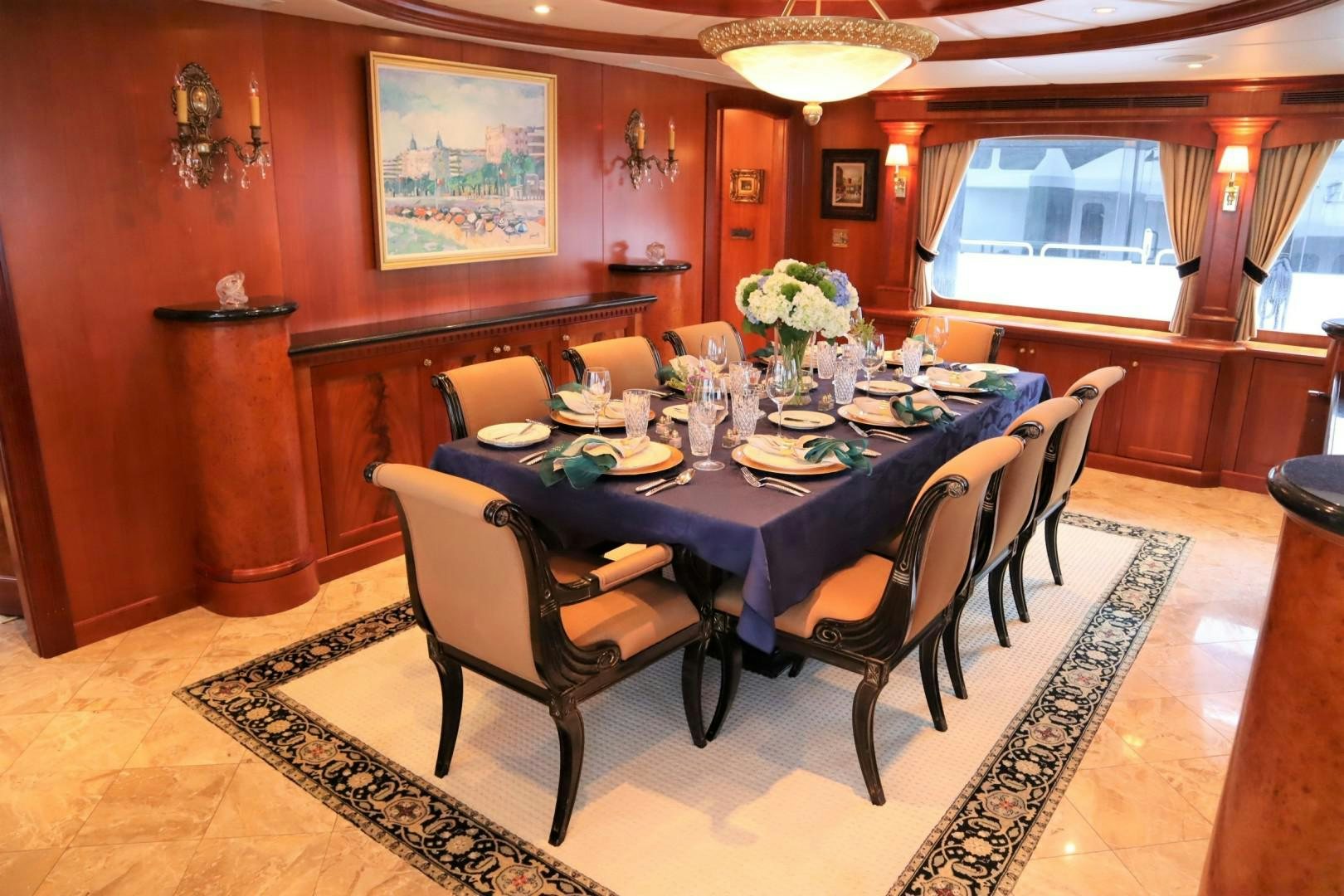 a dining room with a table and chairs aboard ELIZABETH Yacht for Sale