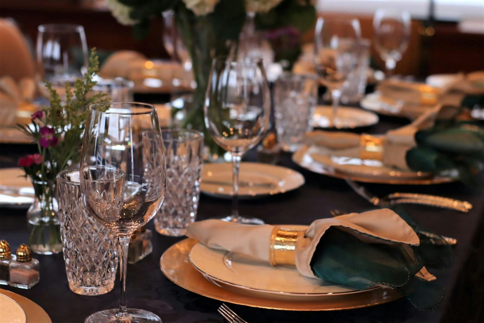 a table with wine glasses and food aboard ELIZABETH Yacht for Sale