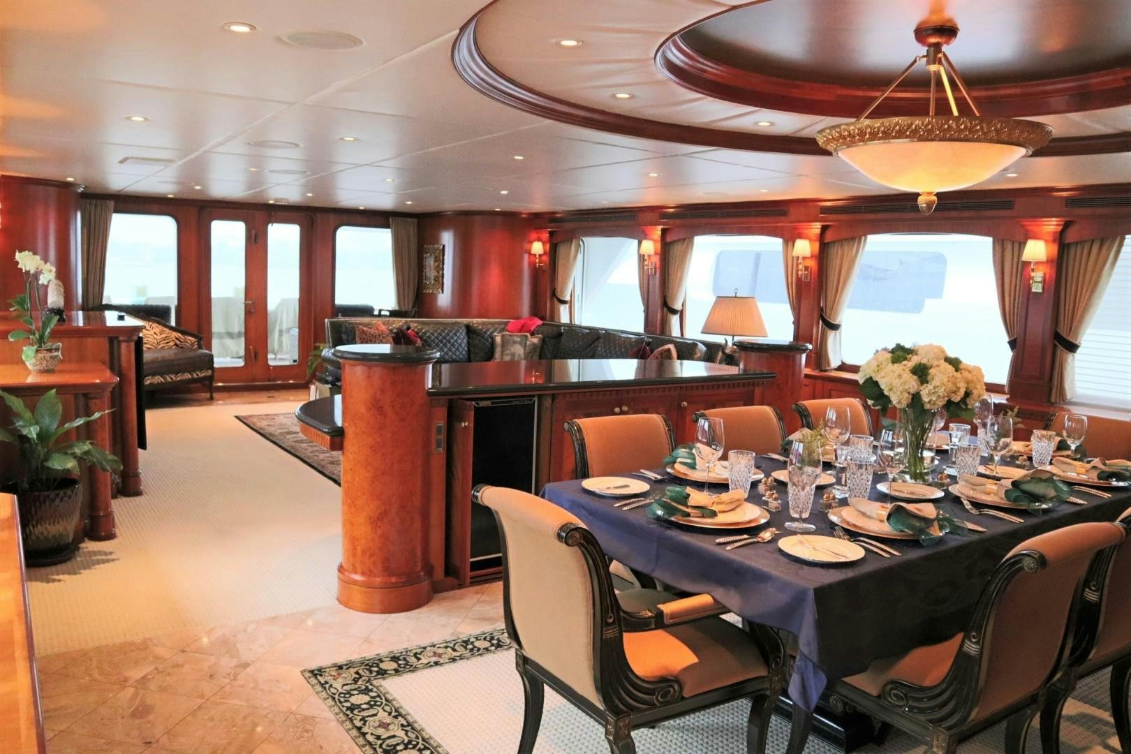 a dining room with a table set for a meal aboard ELIZABETH Yacht for Sale