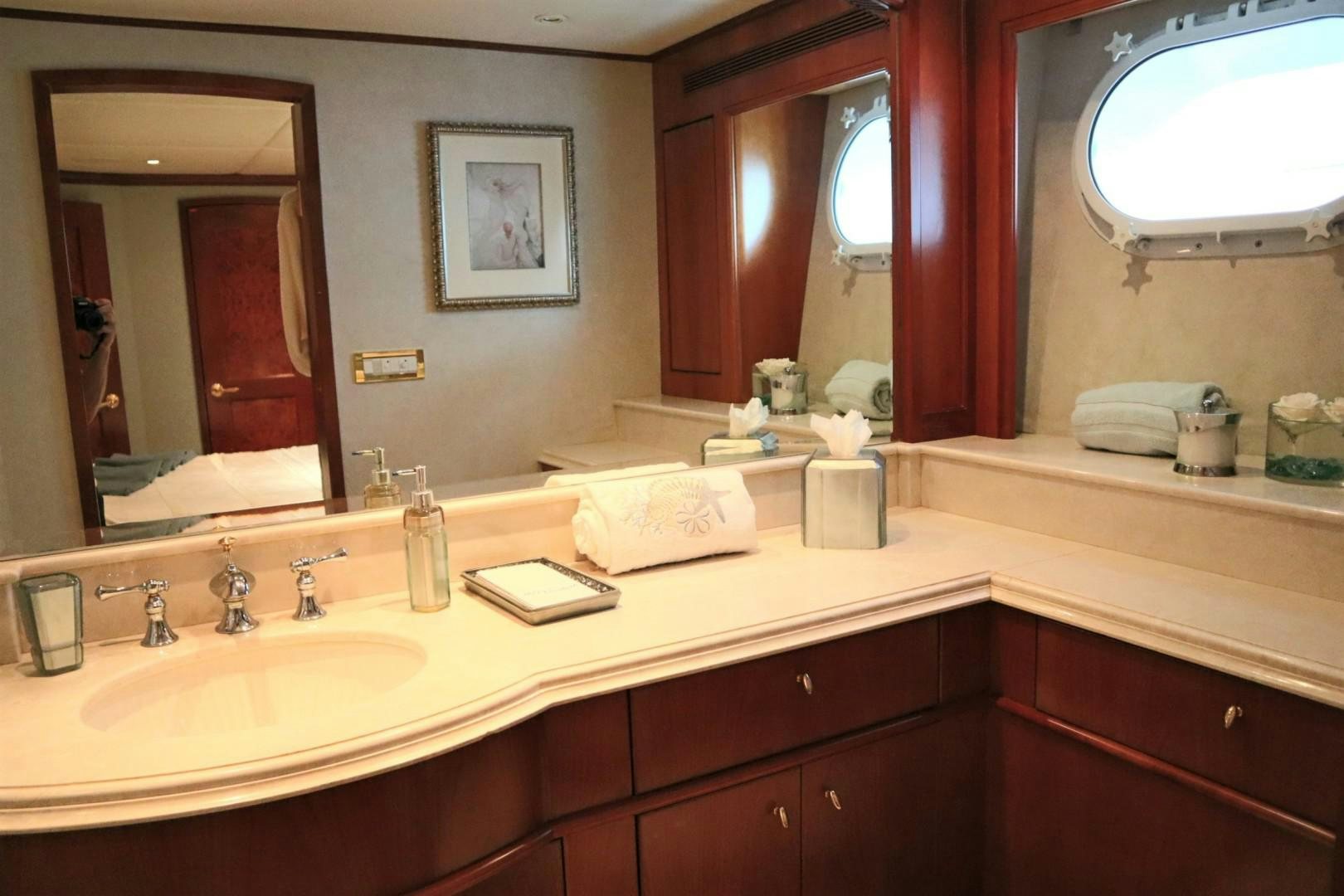 a bathroom with a large mirror aboard ELIZABETH Yacht for Sale
