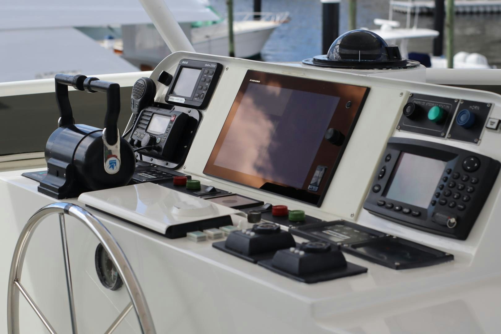 a desk with a computer and other electronics on it aboard ELIZABETH Yacht for Sale