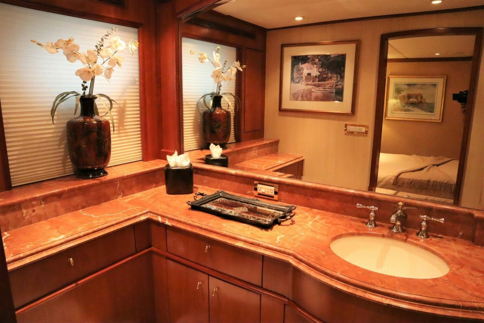 a bathroom with a large mirror aboard ELIZABETH Yacht for Sale