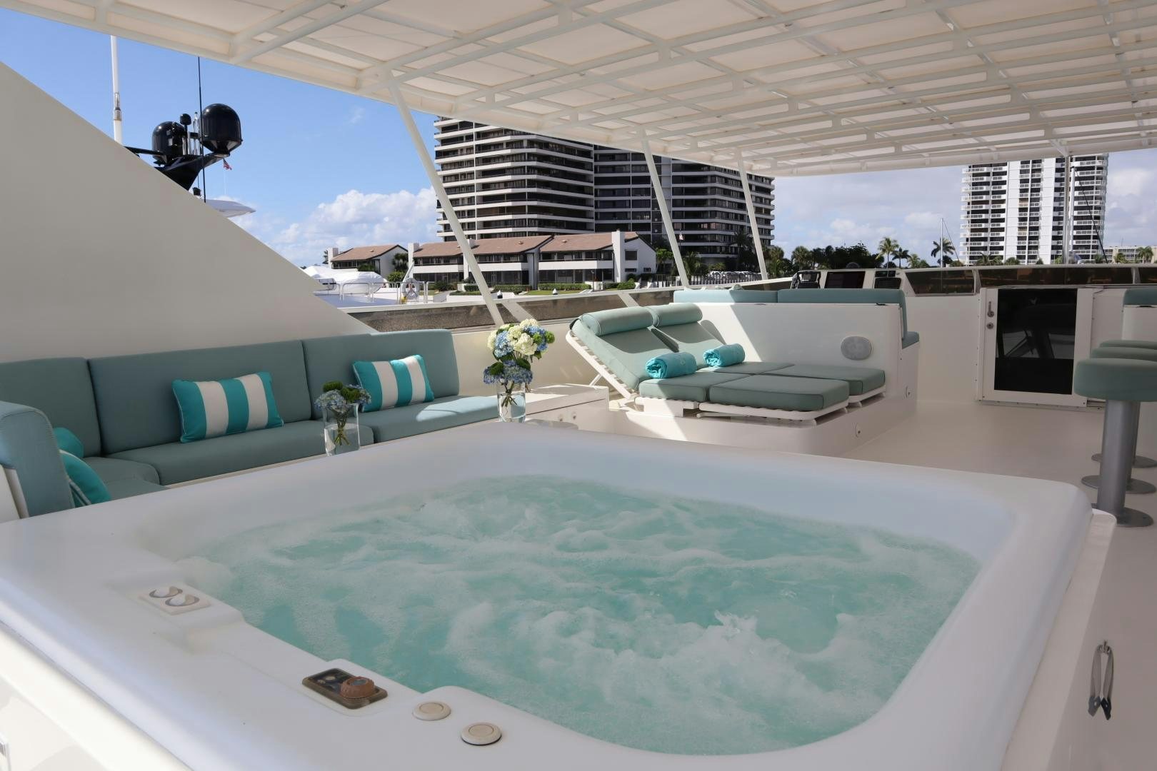 a large white lounge area with a large white table and chairs aboard ELIZABETH Yacht for Sale